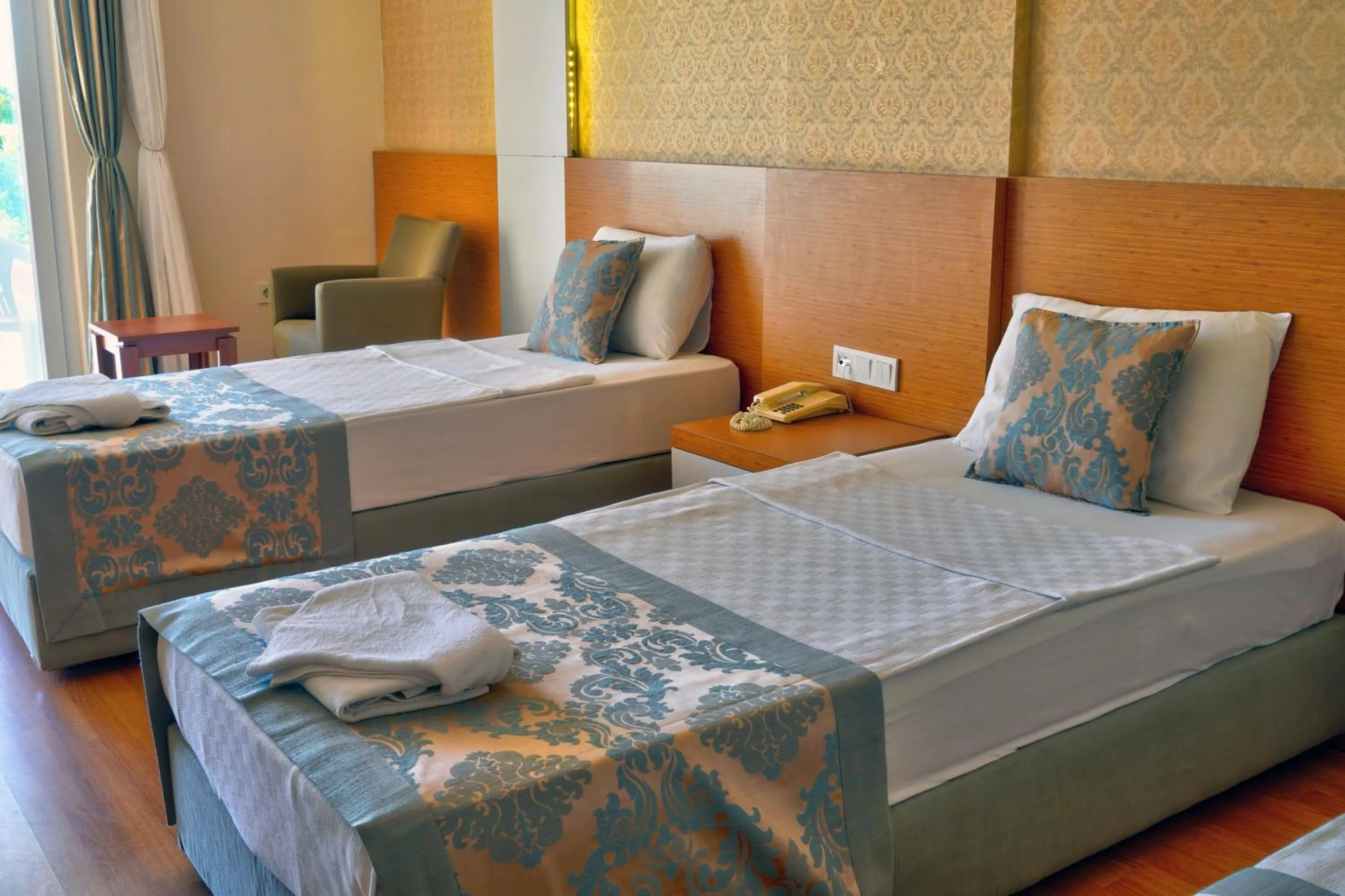 Bed in Blue Fish Hotel All Inclusive