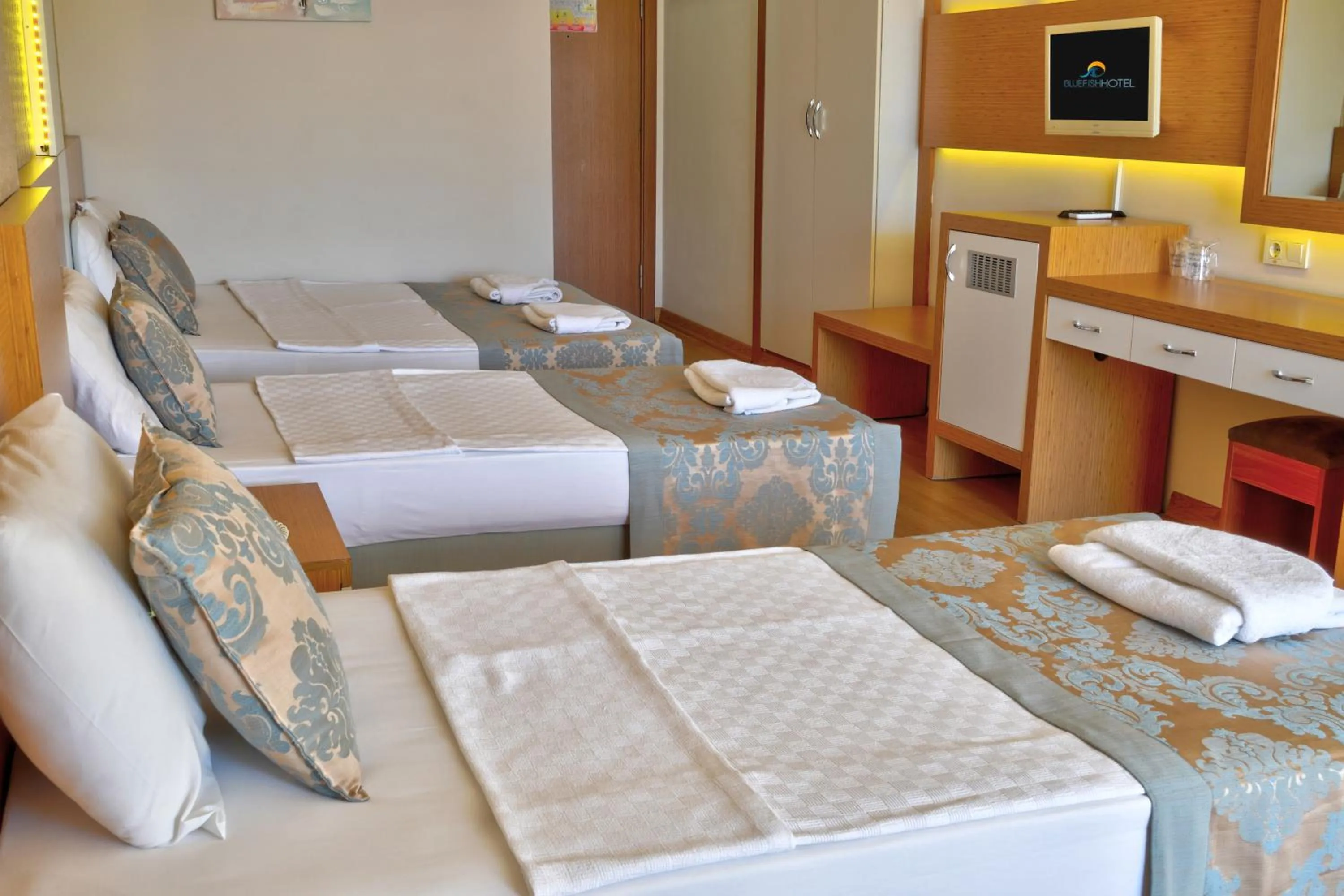 Bed in Blue Fish Hotel All Inclusive