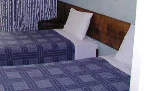 Bed in Oasis Hotel