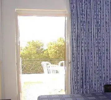 Balcony/Terrace, Bed in Oasis Hotel Balcony/Terrace, Bed in Oasis Hotel