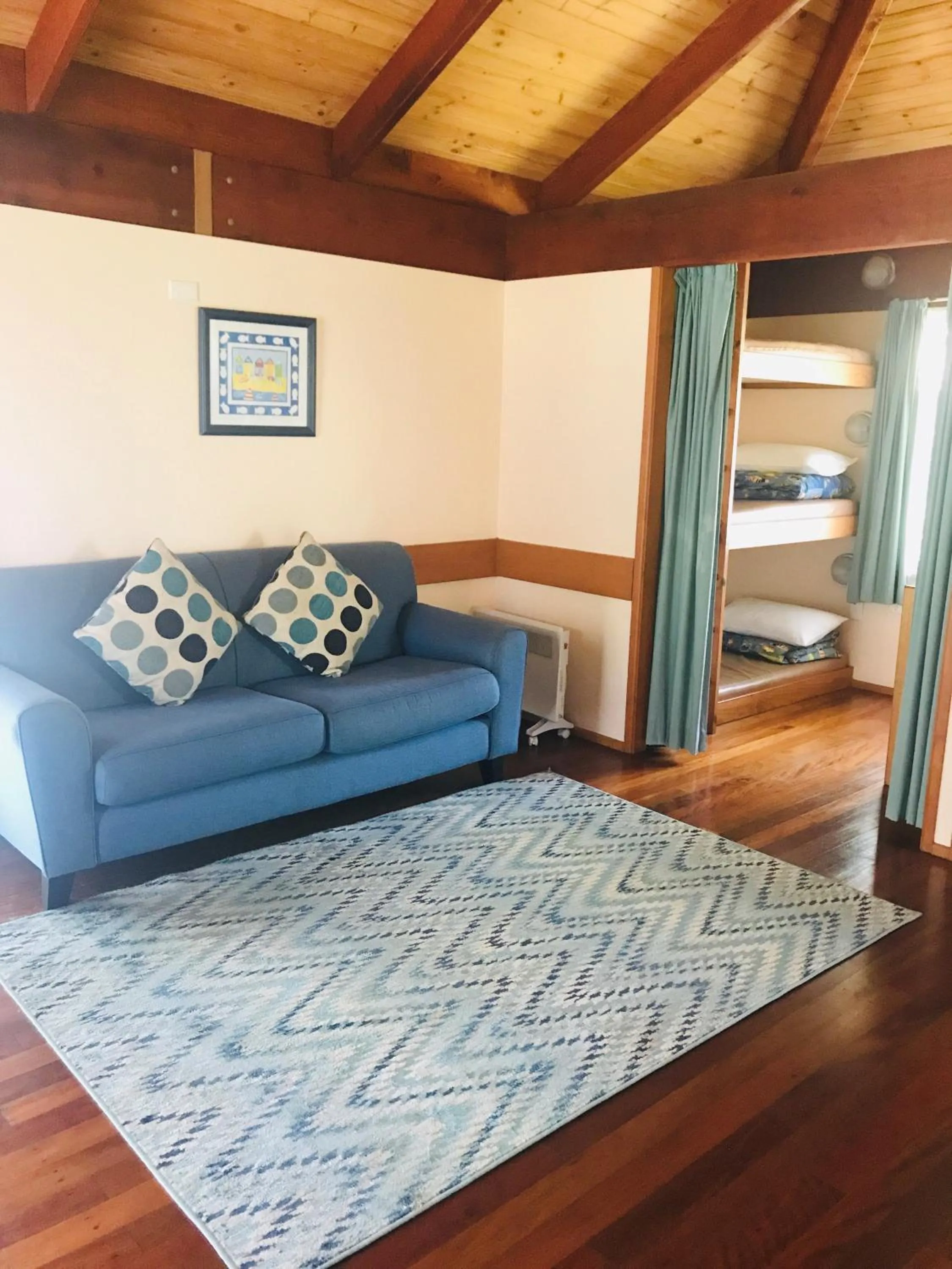Living room, Bed in Lighthouse Beach Holiday Village