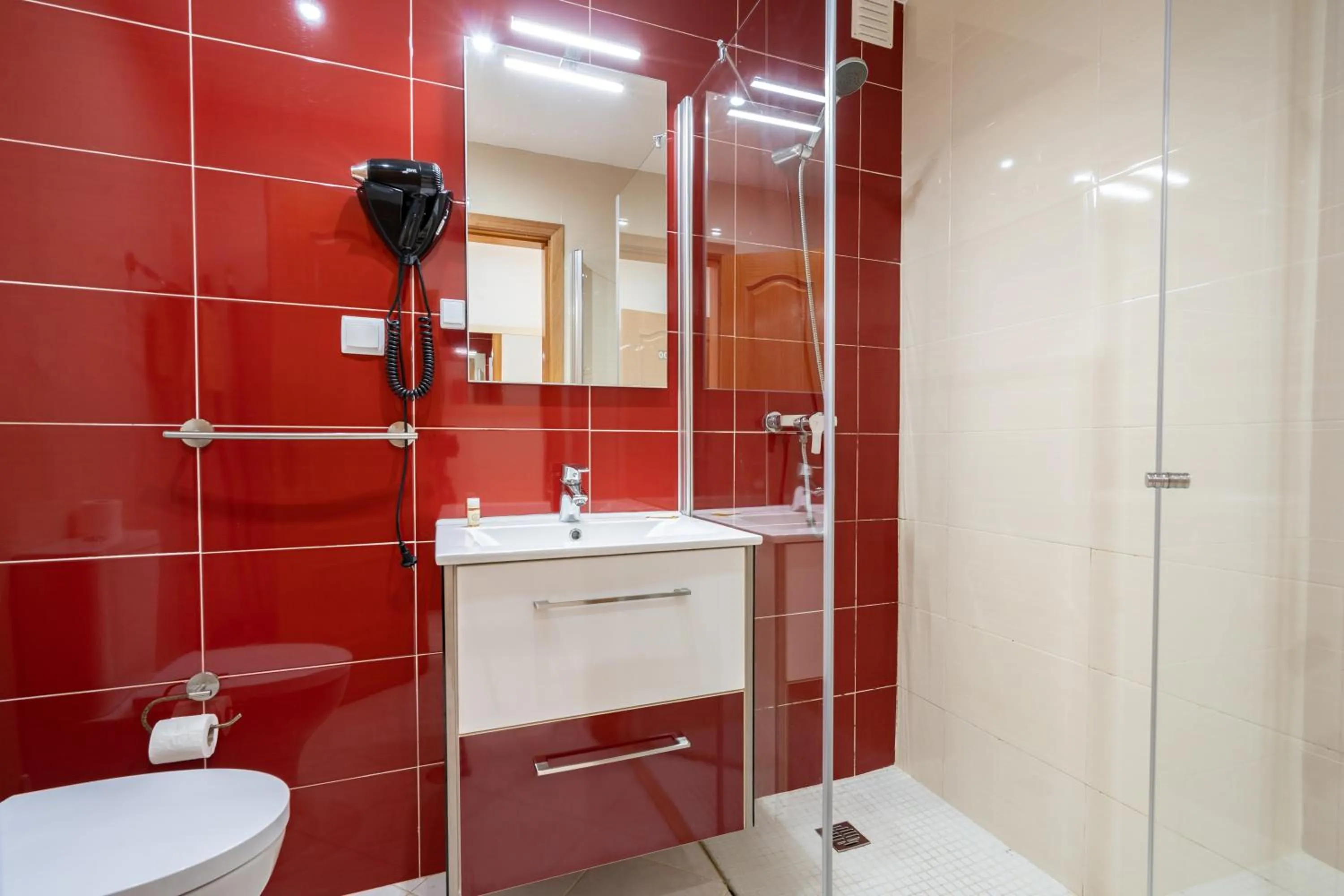 Shower in Apartamentos Vale de Carros by Umbral