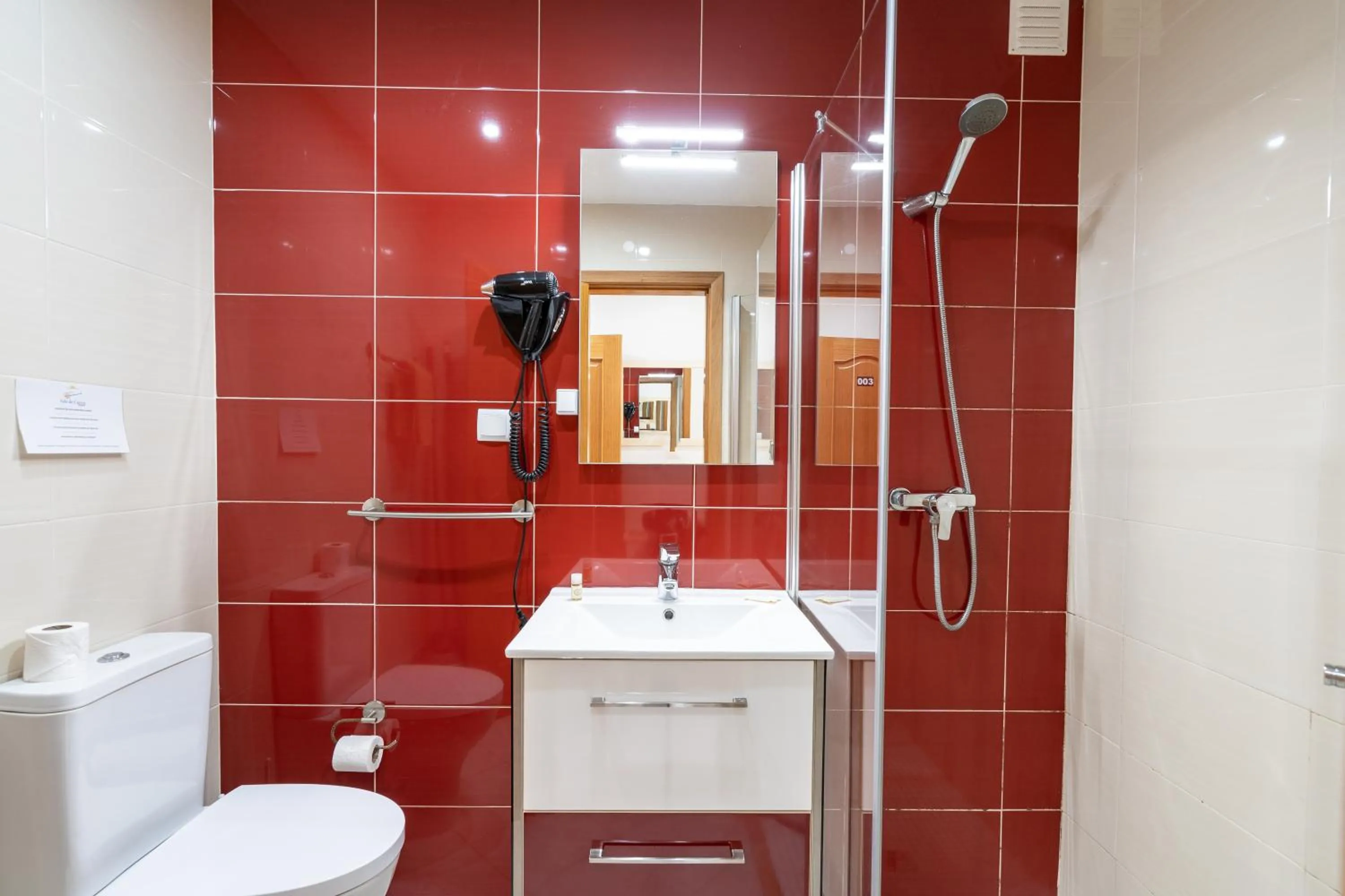 Shower in Apartamentos Vale de Carros by Umbral