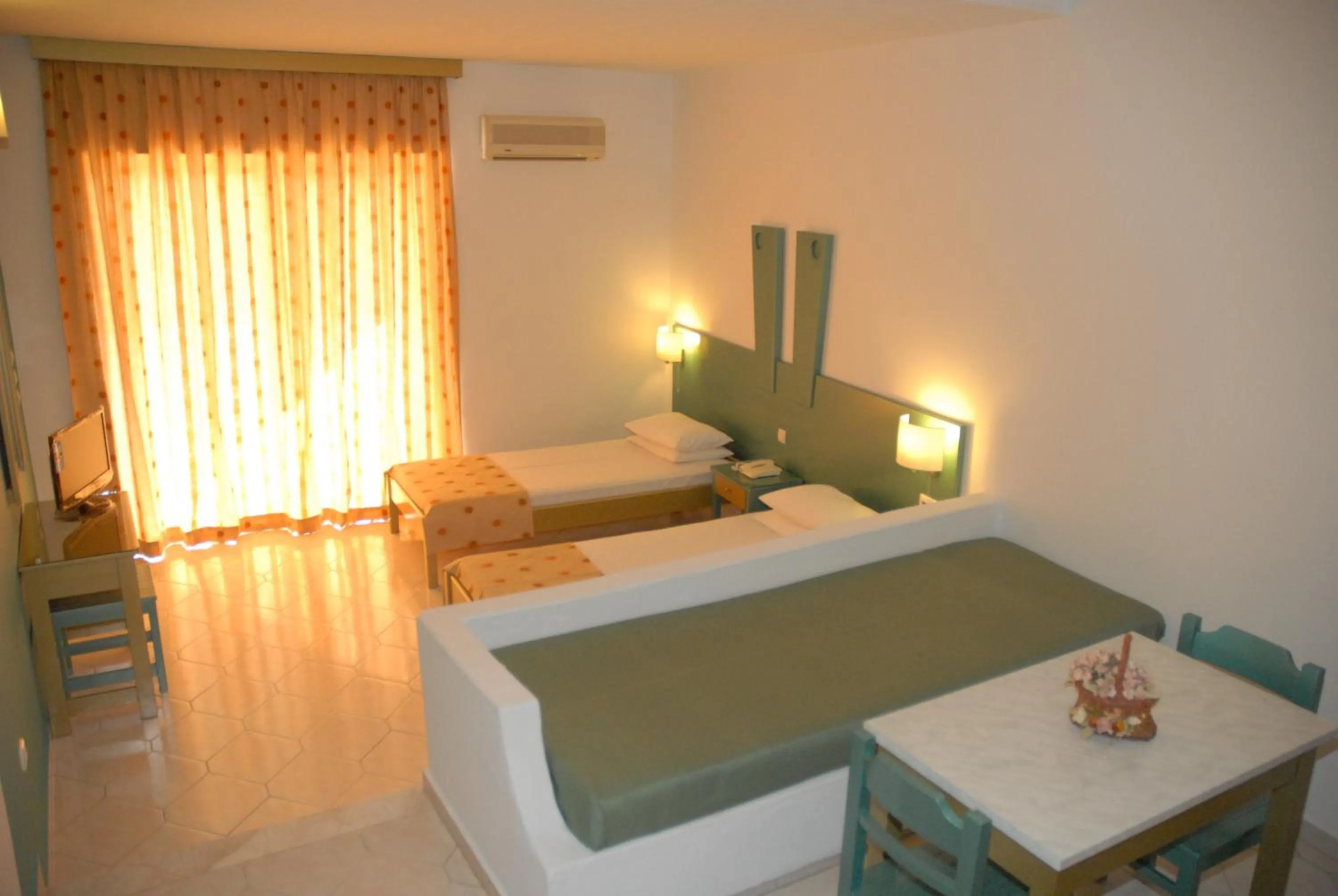 Bed in Trianta Hotel Apartments