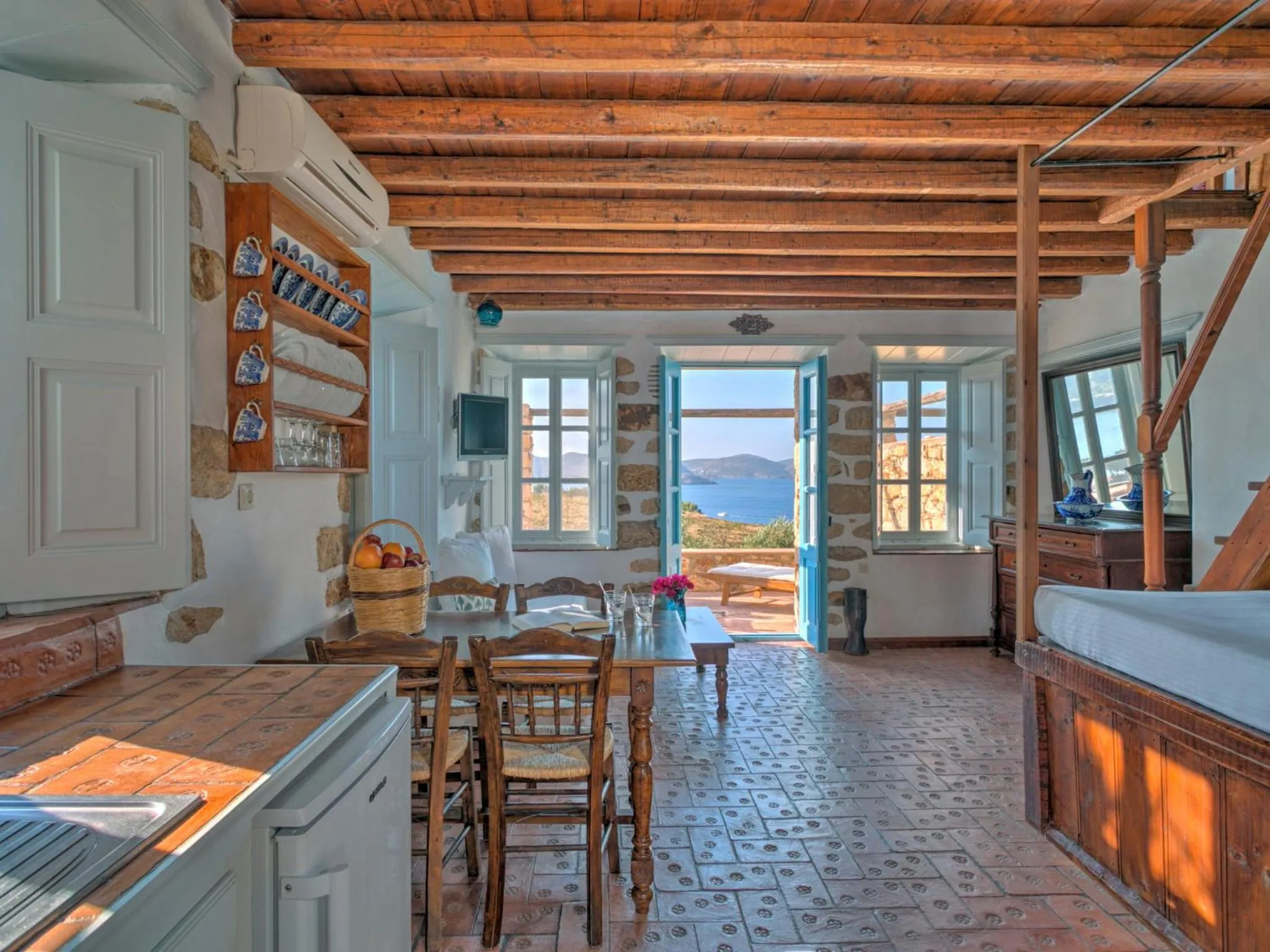 Kitchen or kitchenette in Eirini Luxury Hotel Villas