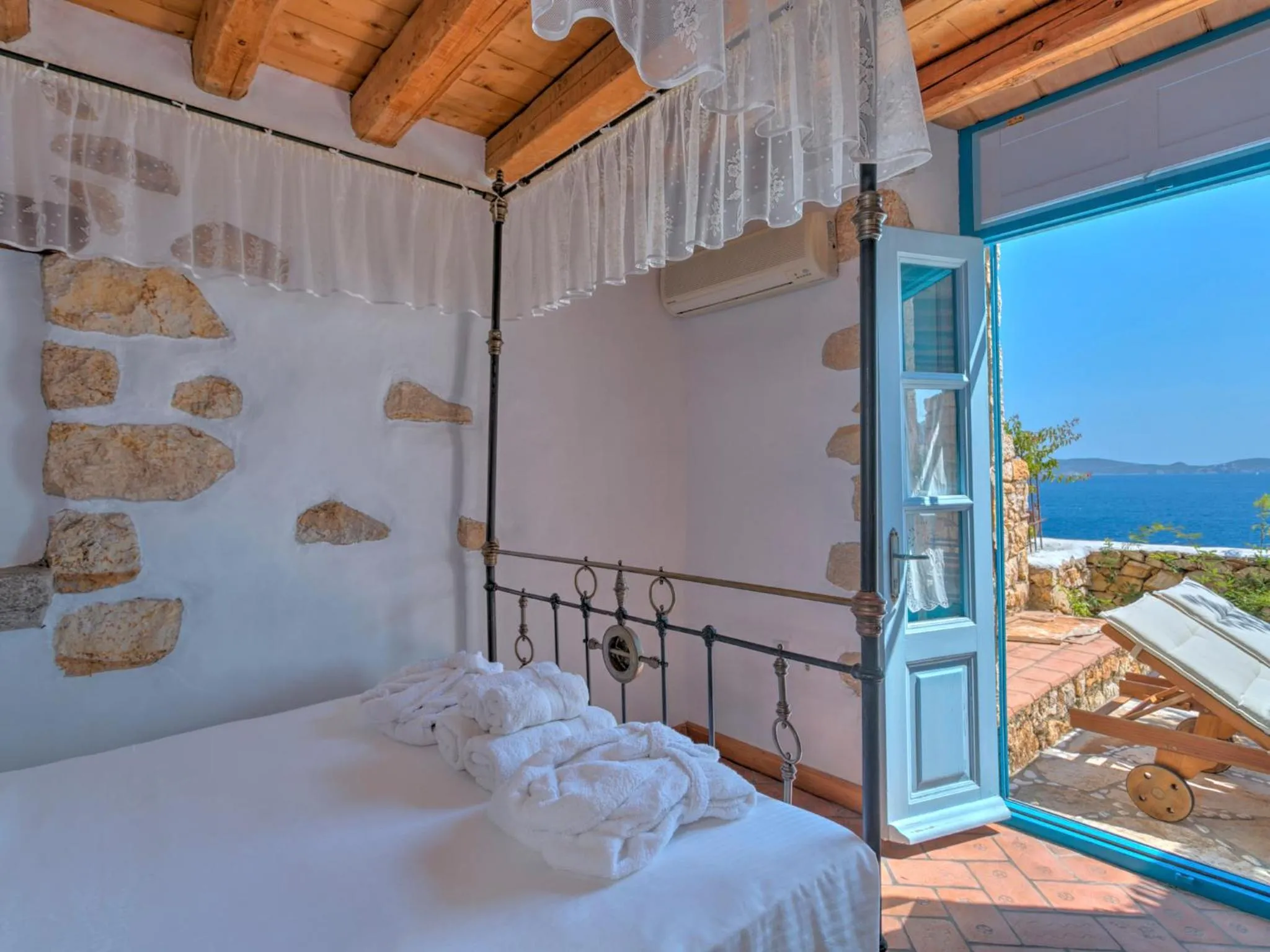 Balcony/Terrace, Bed in Eirini Luxury Hotel Villas