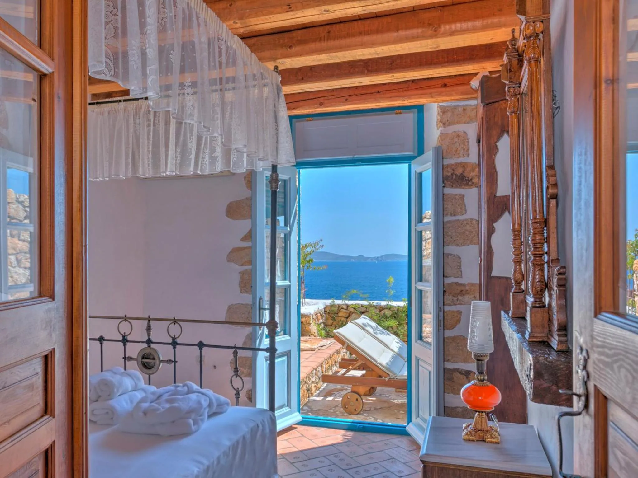 View (from property/room), Bed in Eirini Luxury Hotel Villas