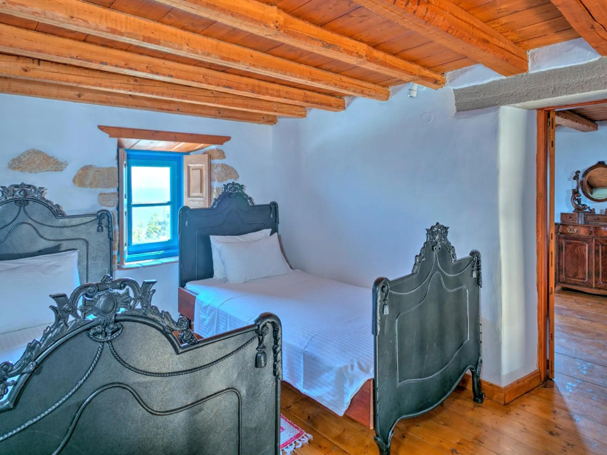 Bed in Eirini Luxury Hotel Villas