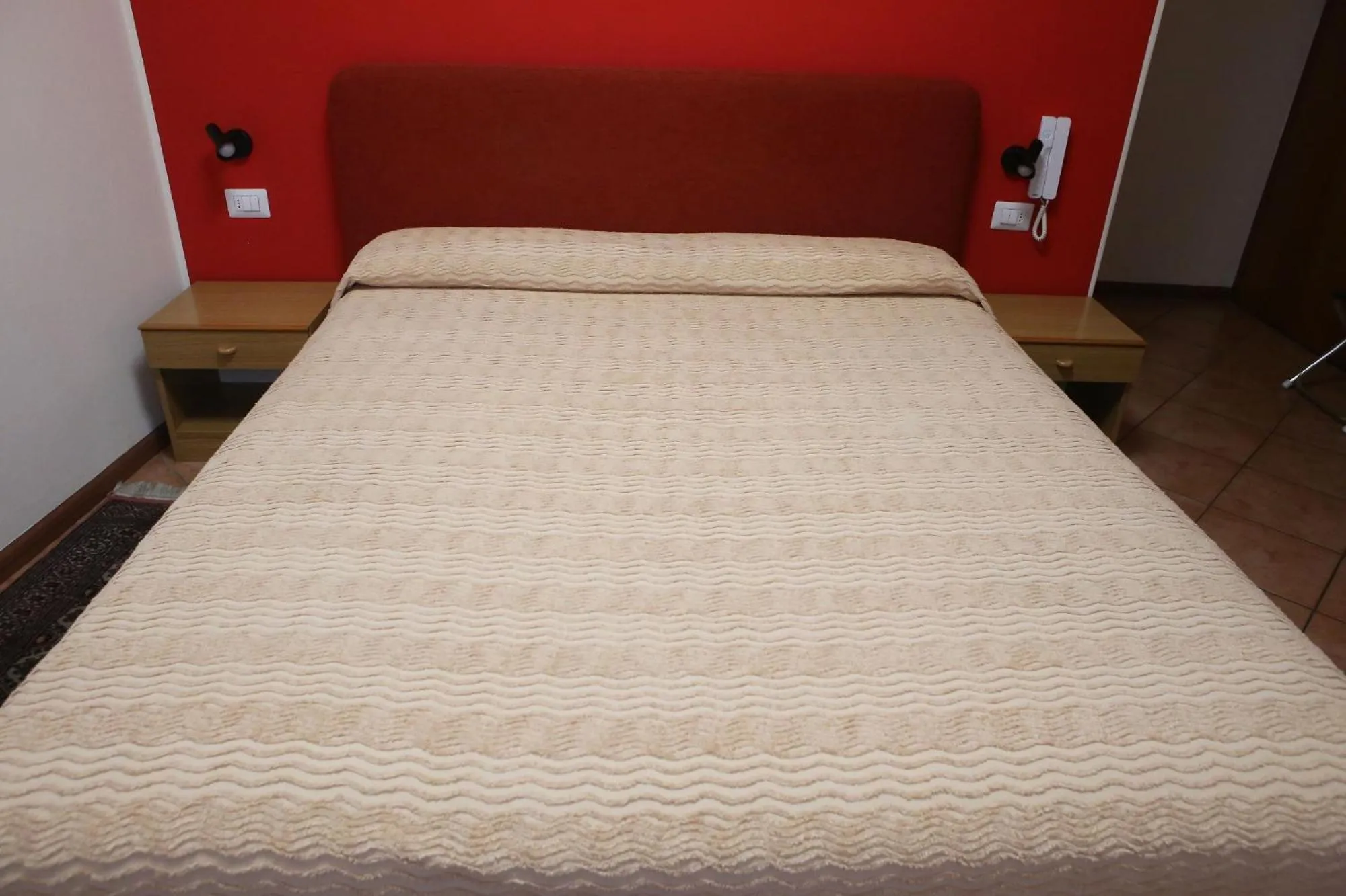 Bed in Albergo Gusmeroli