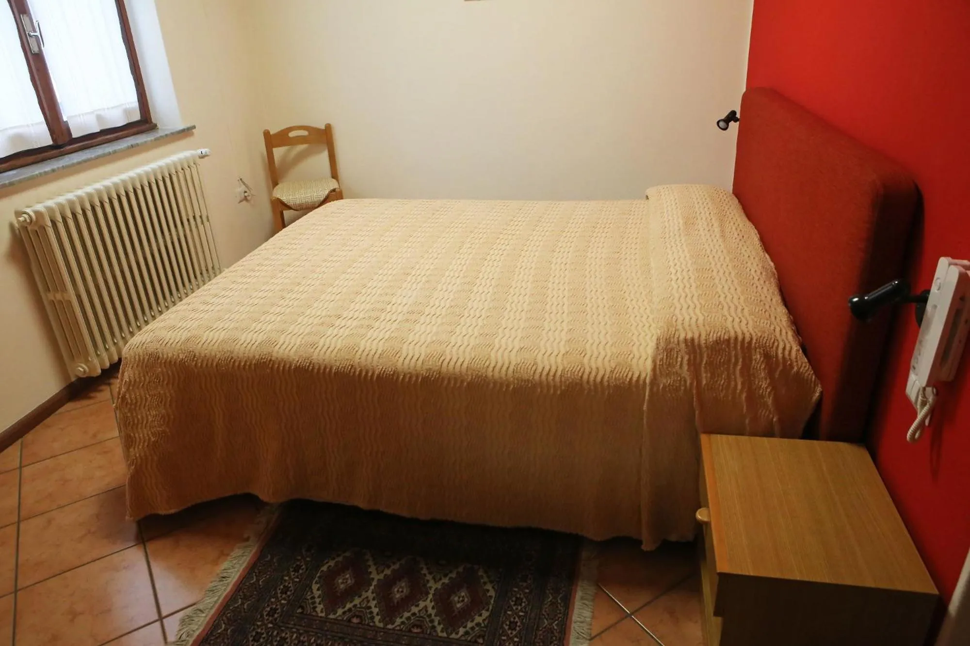 Bed in Albergo Gusmeroli