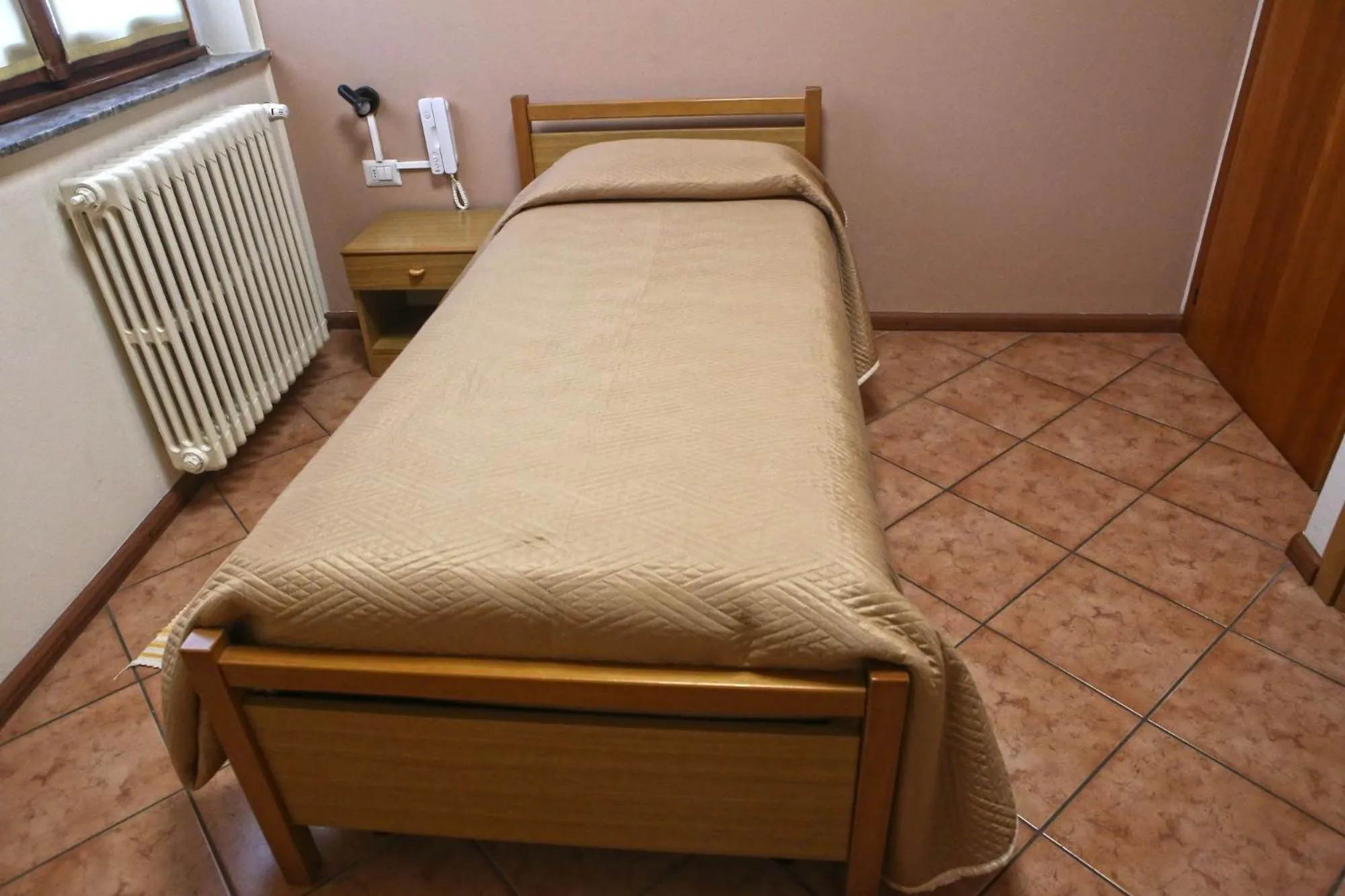 Bed in Albergo Gusmeroli