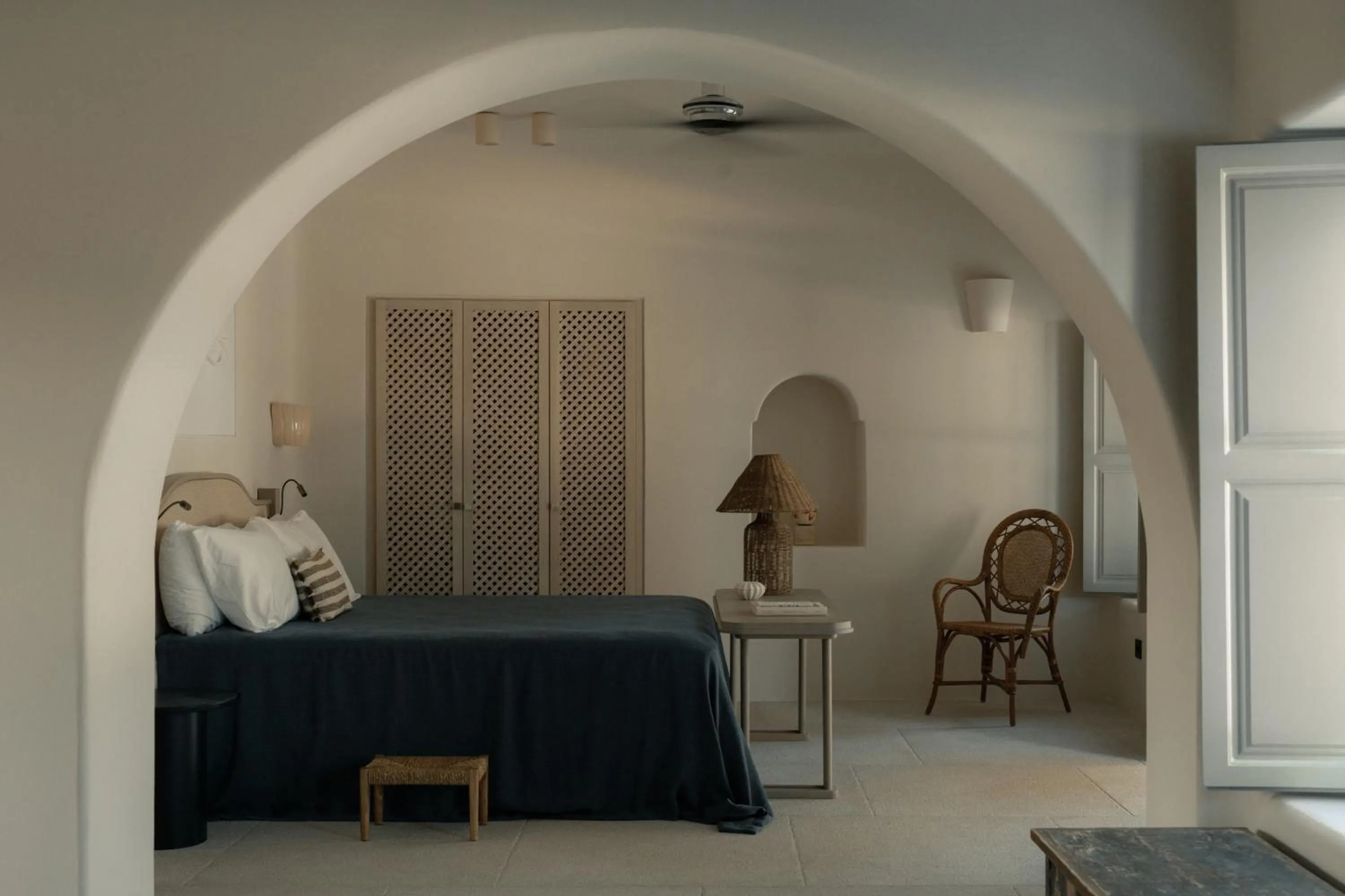 Bed in Black Rose Beach Suites