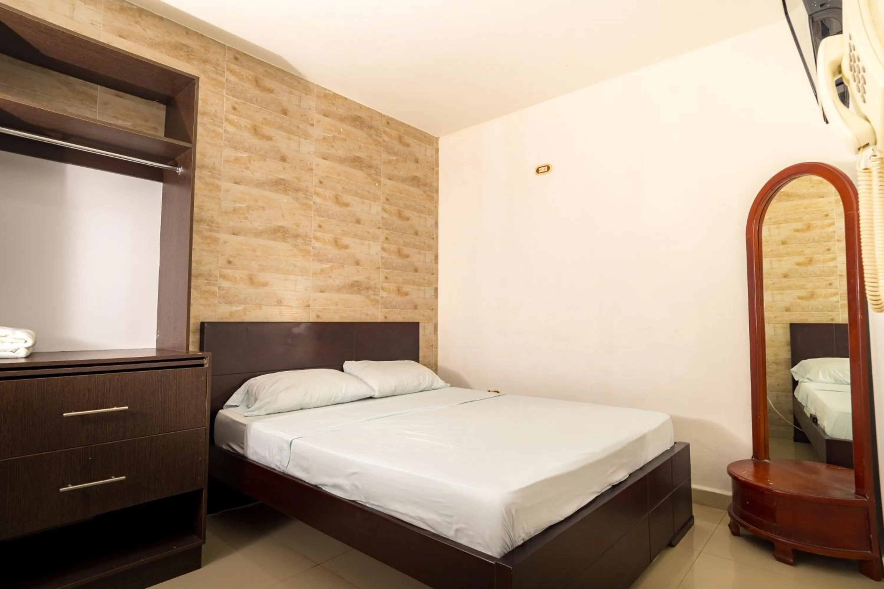 Bed in Genesis Hotel