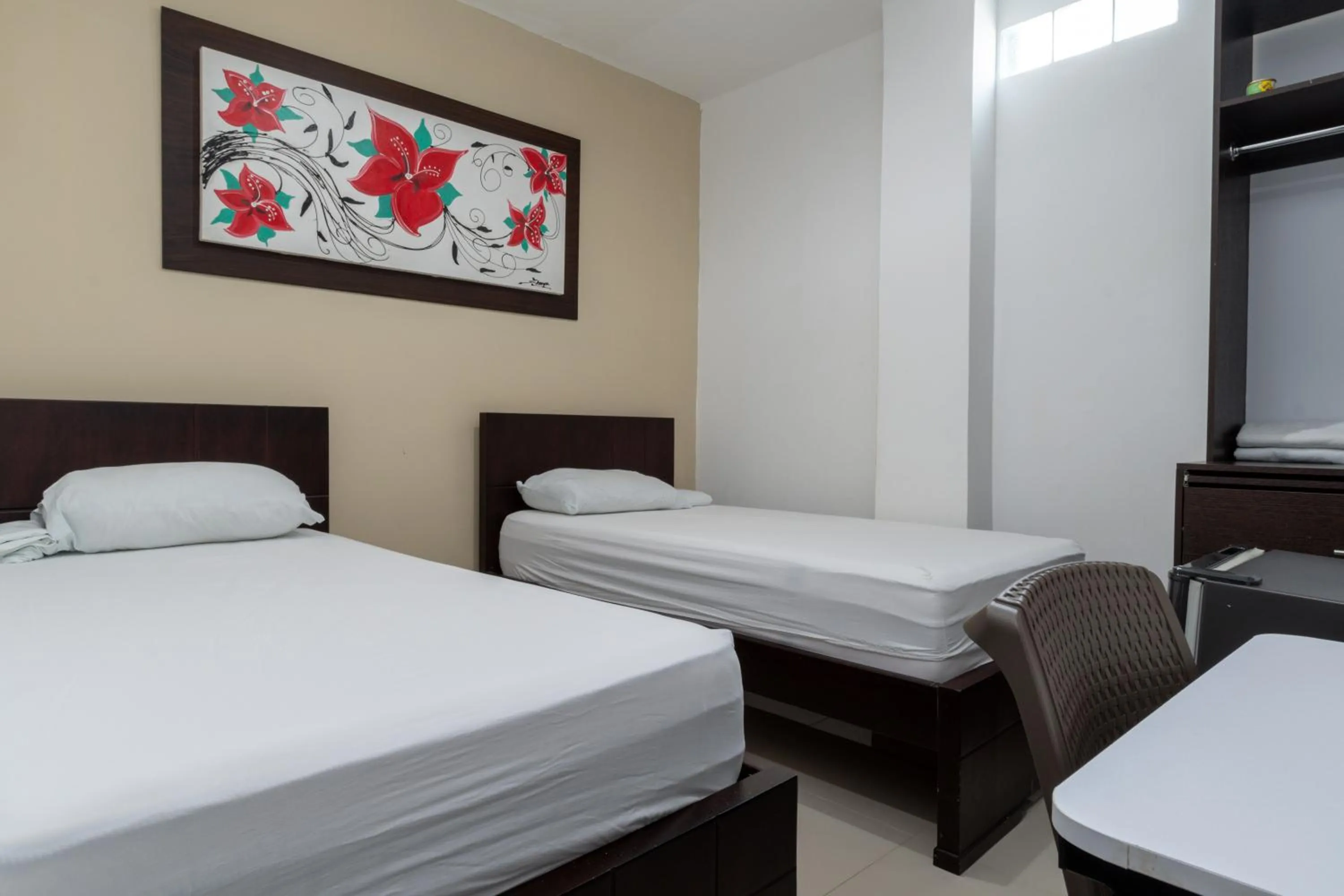 Bed in Genesis Hotel