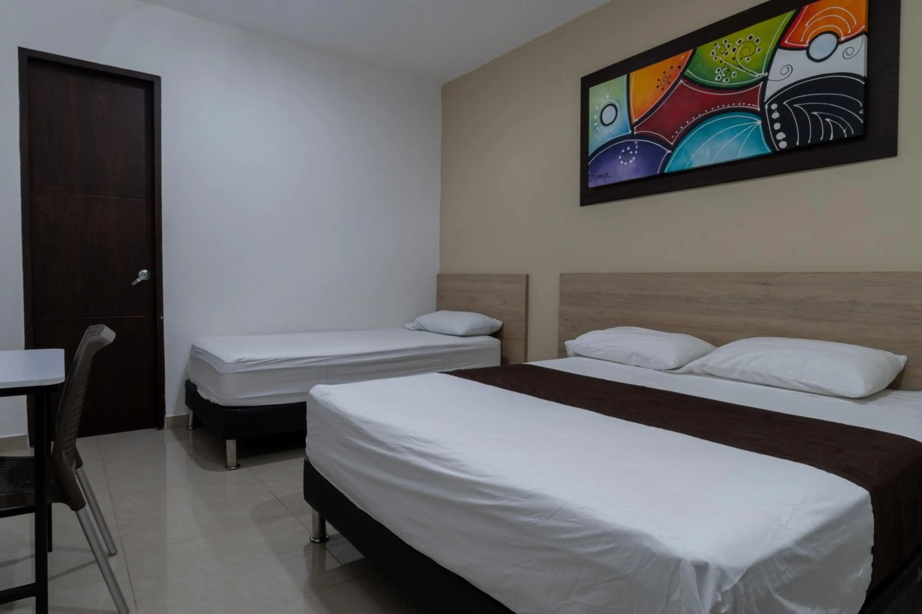 Bed in Genesis Hotel