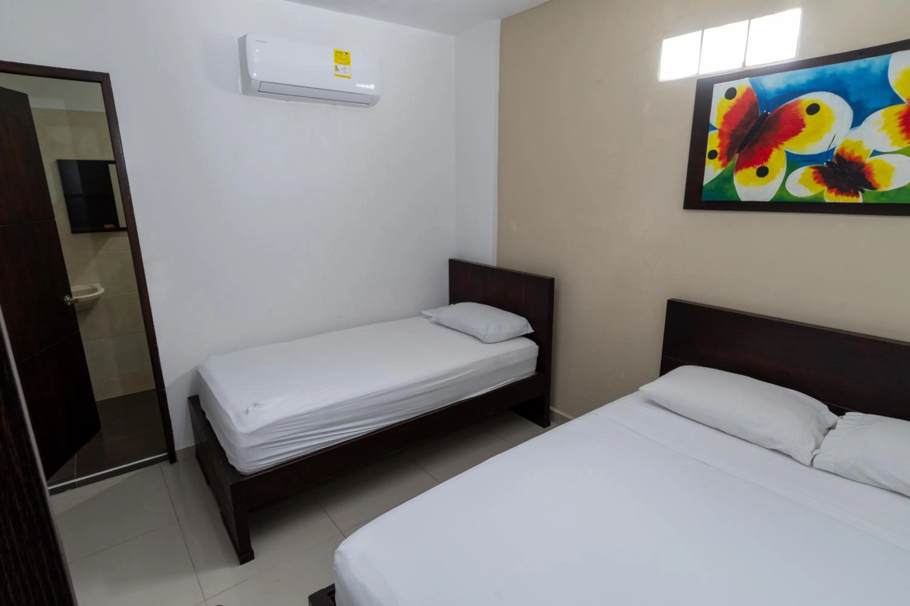 Bed in Genesis Hotel