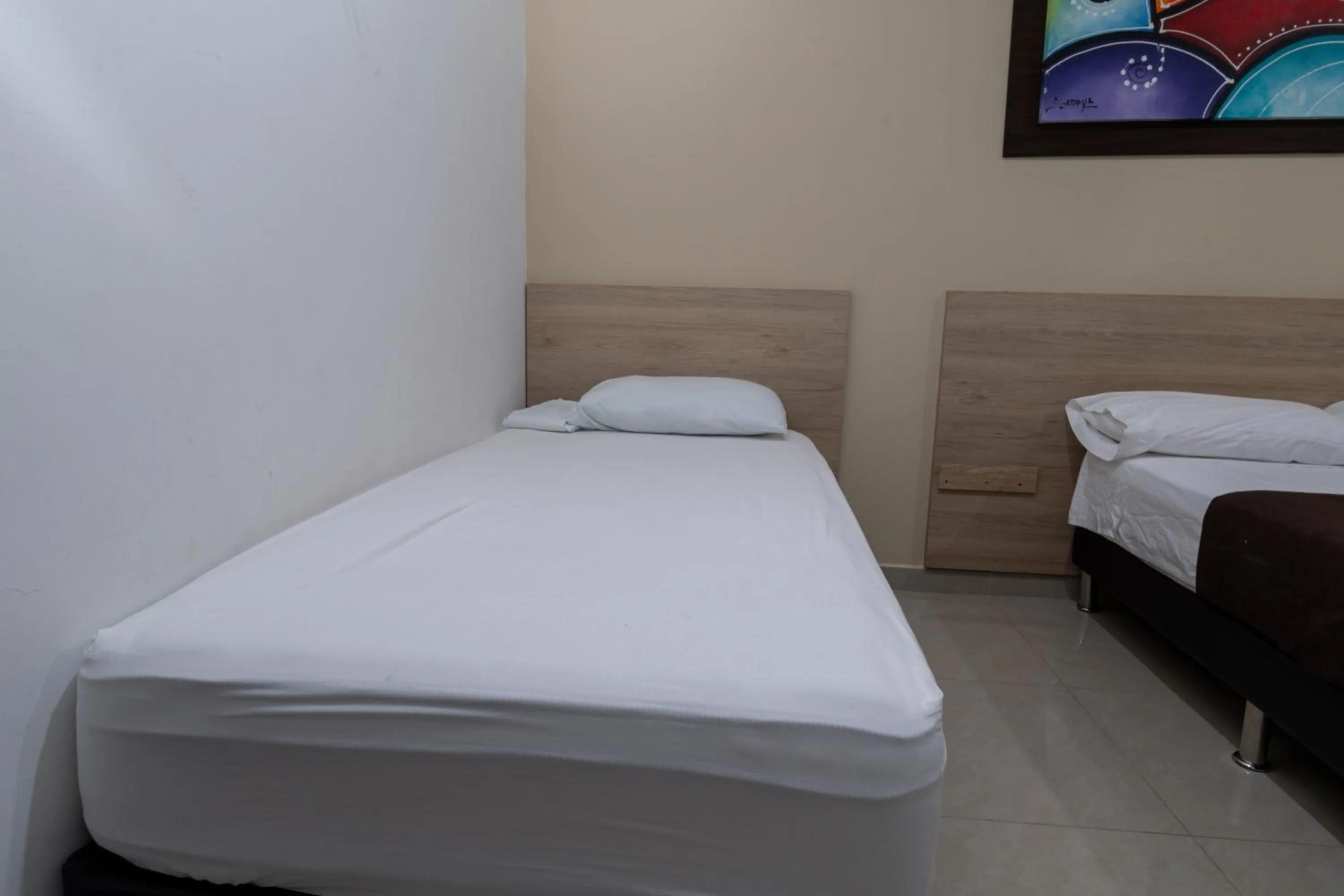 Bed in Genesis Hotel