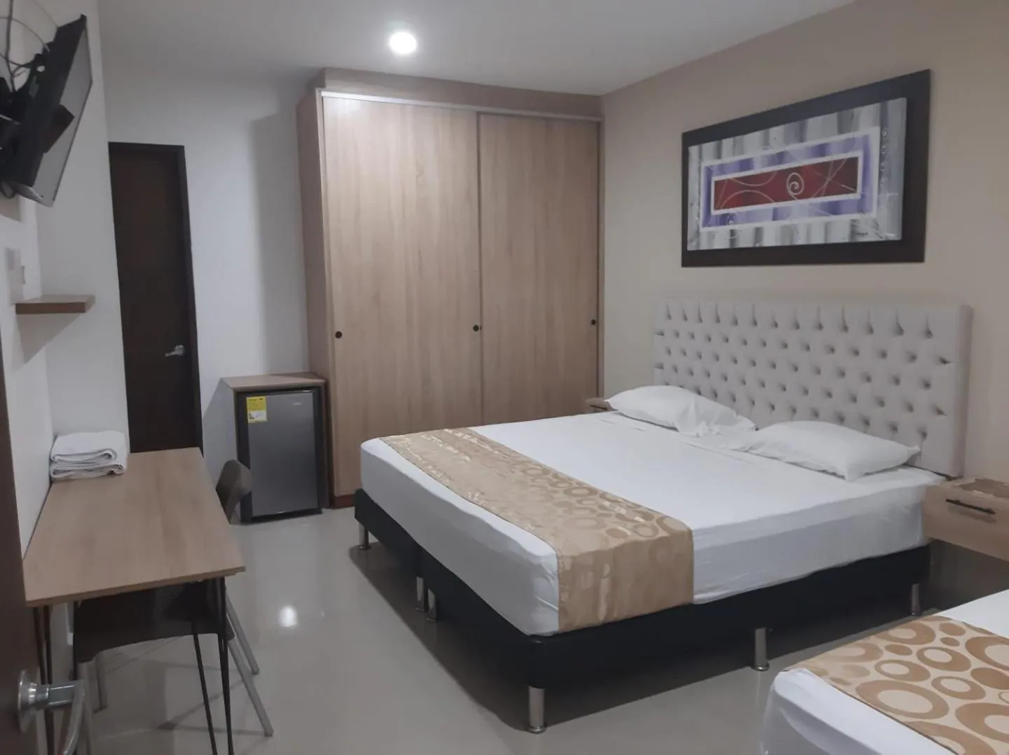 Bed in Genesis Hotel