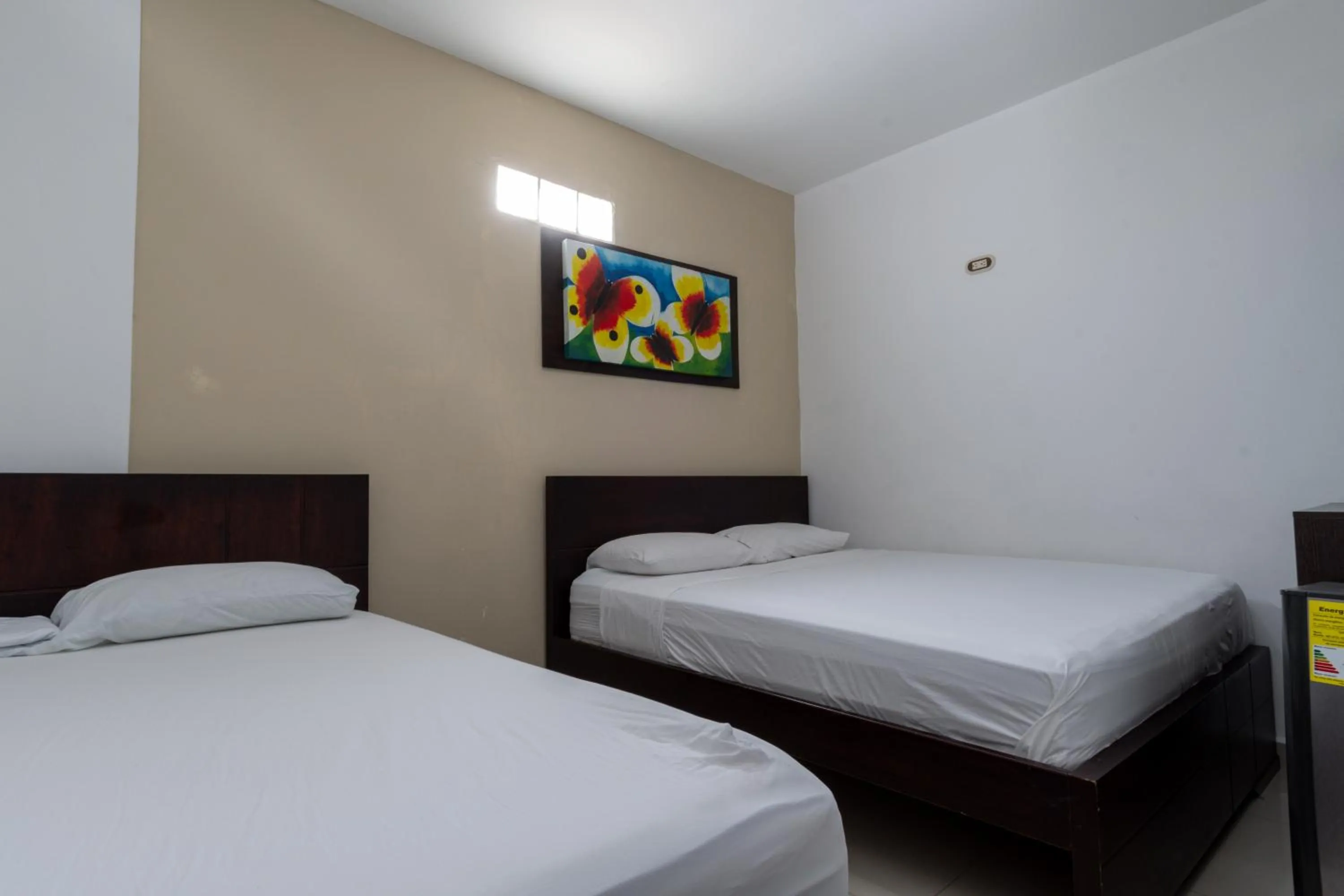 Bed in Genesis Hotel