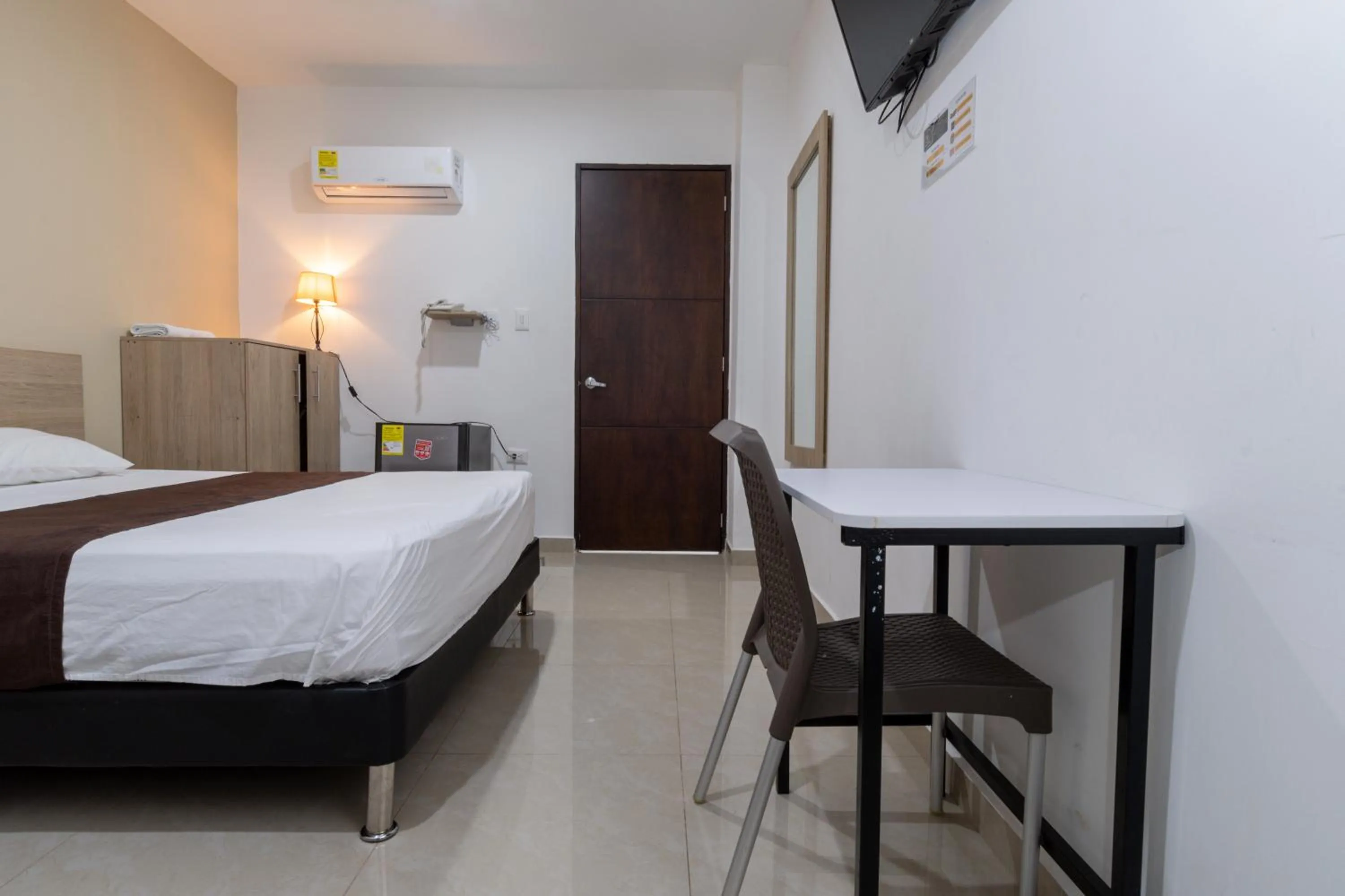 Bed in Genesis Hotel