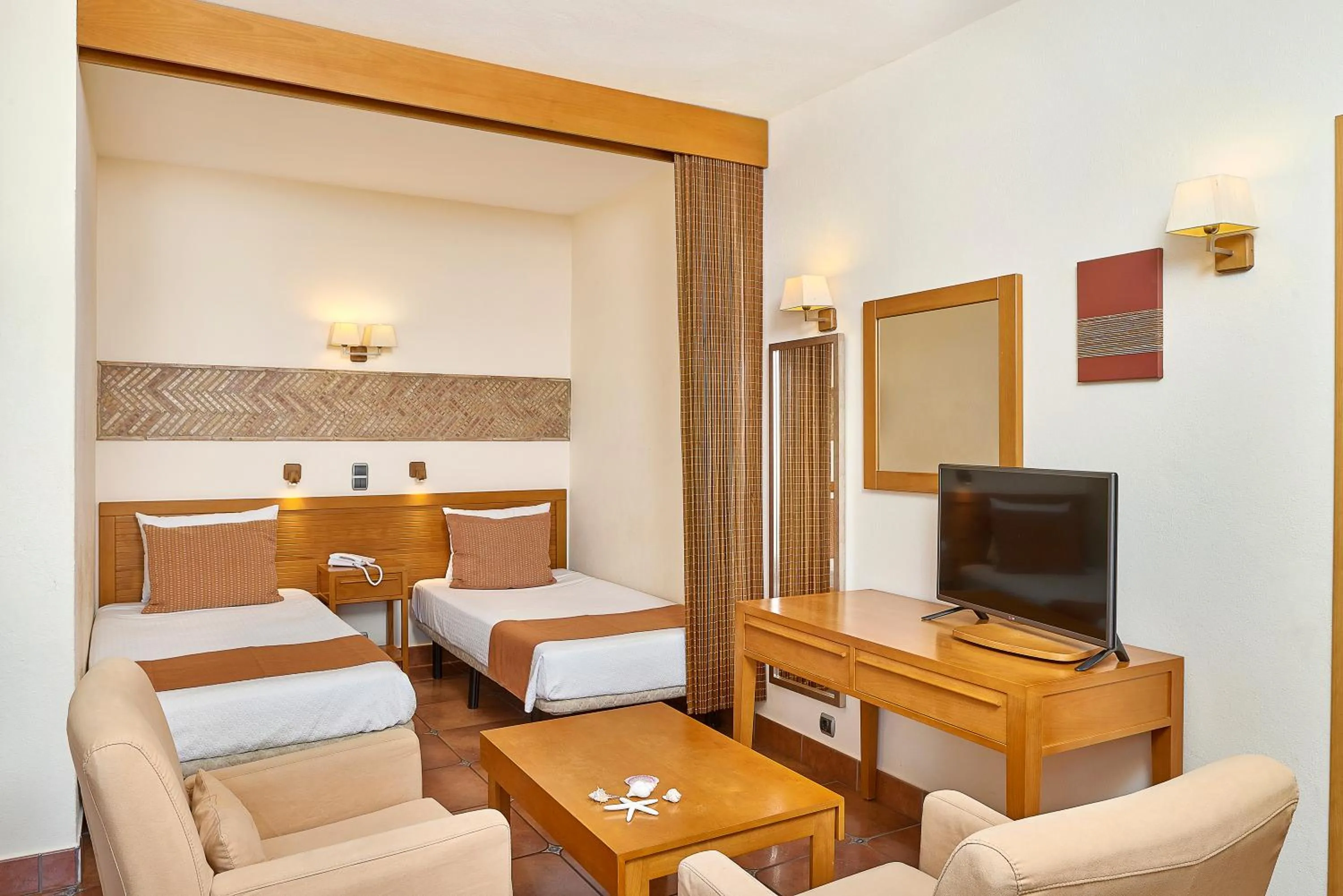 Bed in Oceanus Aparthotel