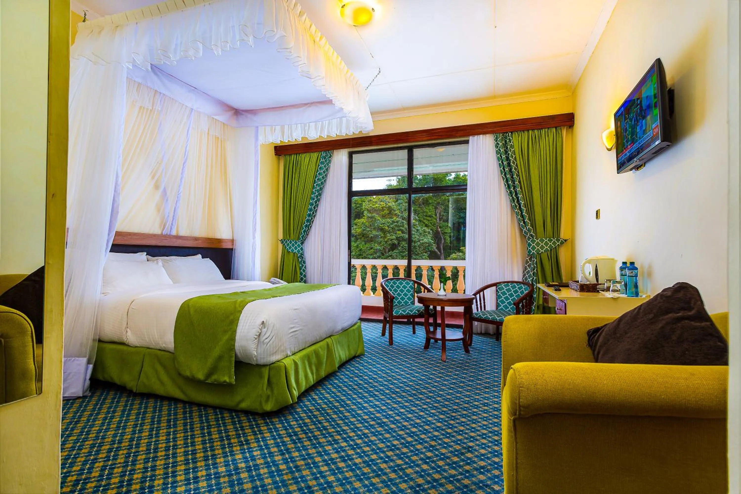 Communal lounge/ TV room, Bed in Rift Valley Hills Resort