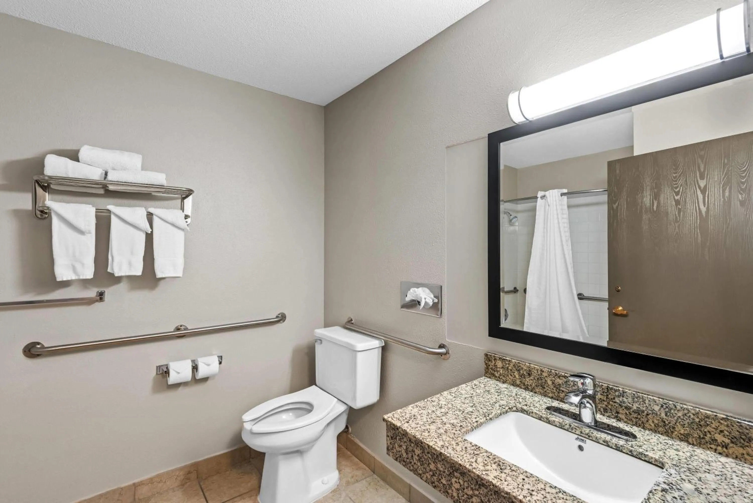 Bathroom in Days Inn & Suites by Wyndham Des Moines Airport