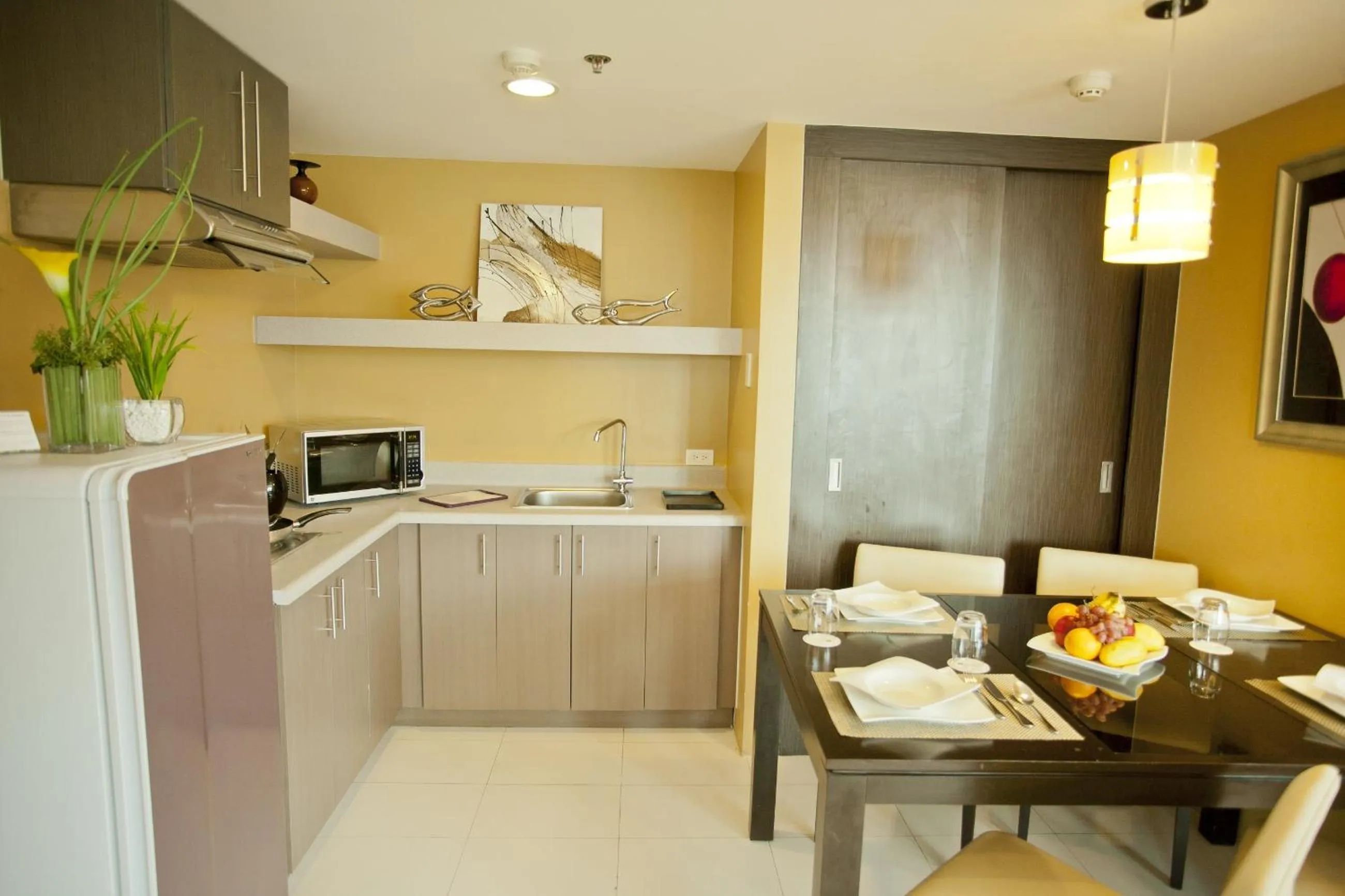 Kitchen or kitchenette in The Exchange Regency Residence Hotel Managed by HII