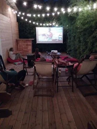 Communal lounge/ TV room in Sunflower Beach Backpacker Hostel & Bar