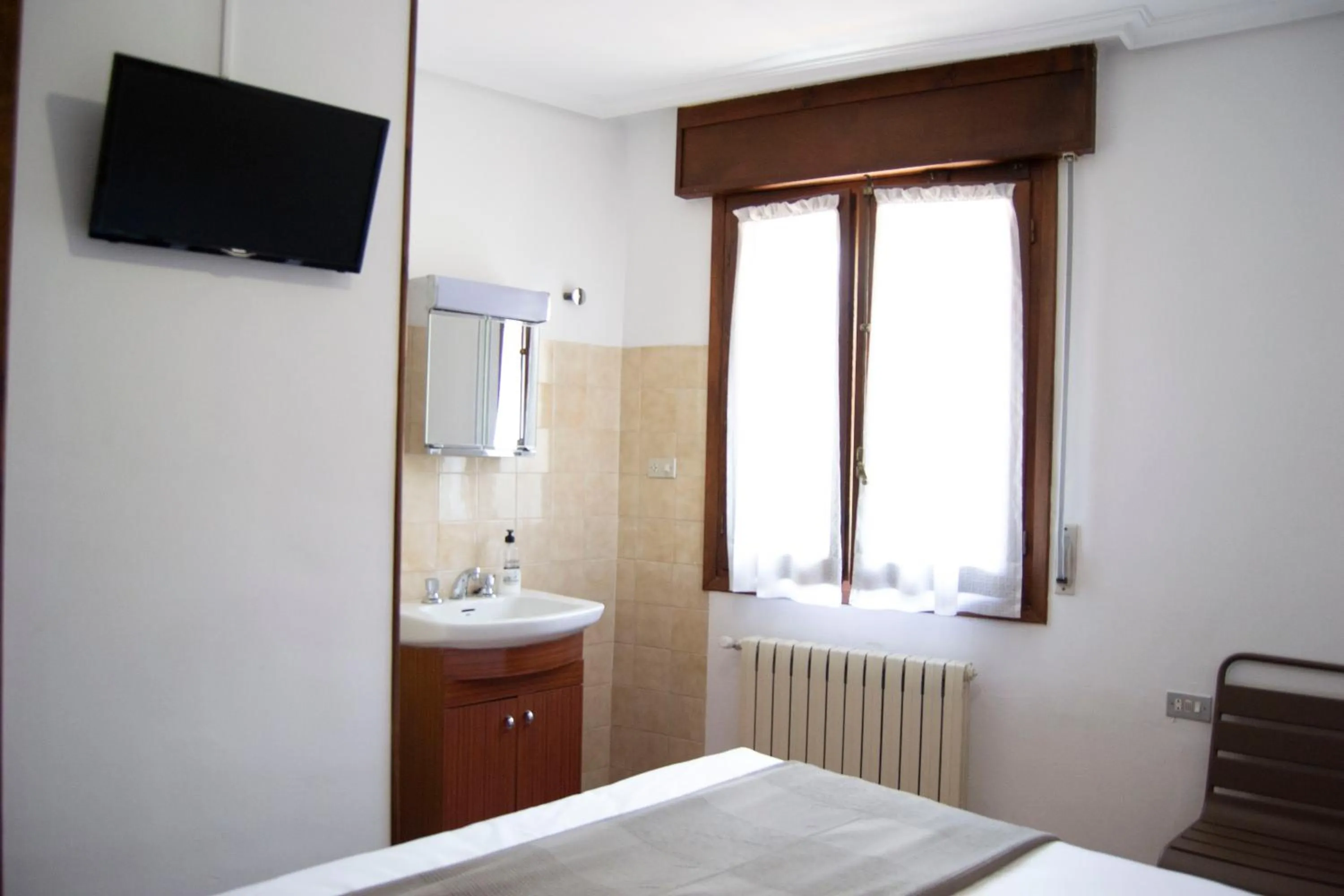 Photo of the whole room, Bed in Tres Puentes Anguiano Apartamentos y Hostal