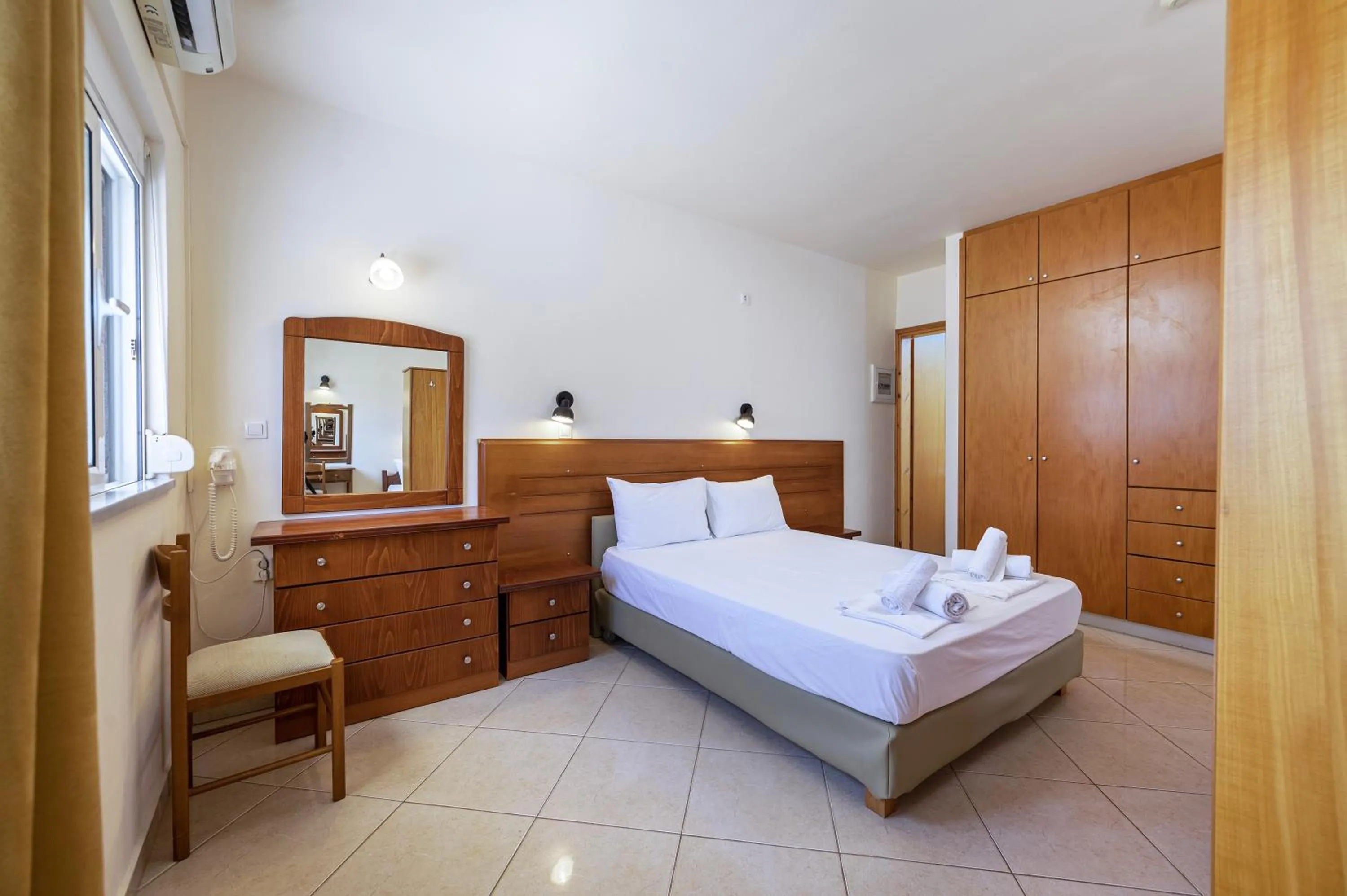 Bed in Mammis Beach Hotel