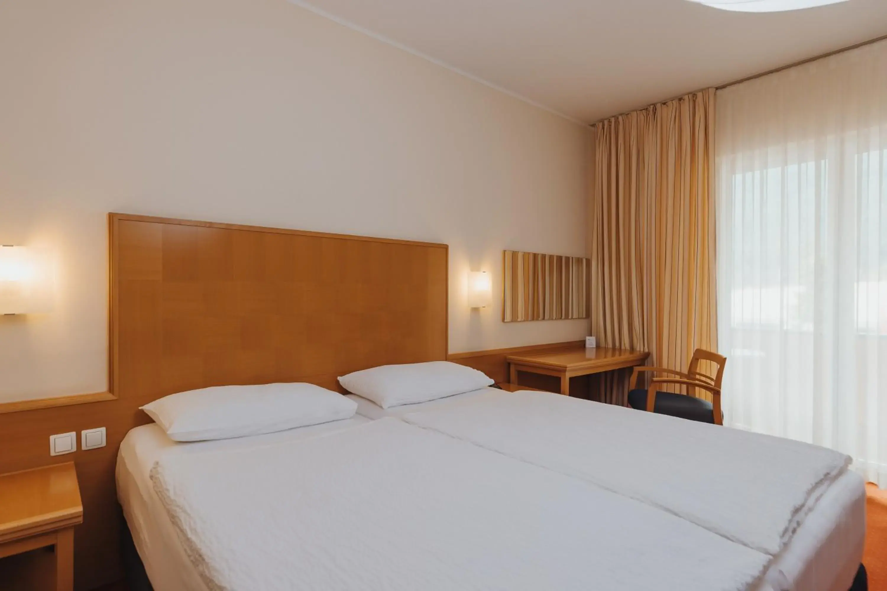 Bedroom, Bed in Ramada Hotel & Suites Kranjska Gora Bedroom, Bed in Ramada Hotel & Suites Kranjska Gora