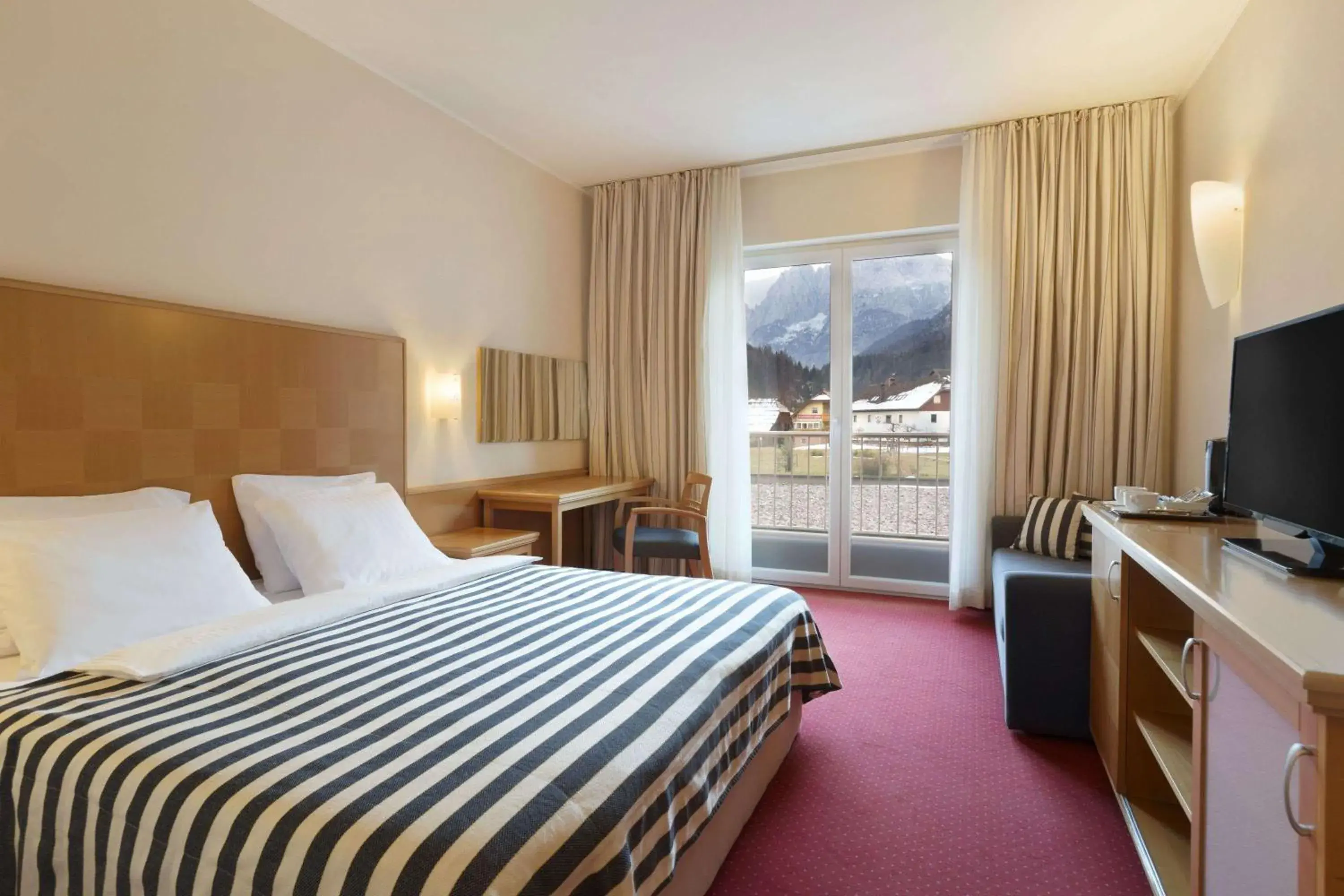 Photo of the whole room, Bed in Ramada Hotel & Suites Kranjska Gora Photo of the whole room, Bed in Ramada Hotel & Suites Kranjska Gora