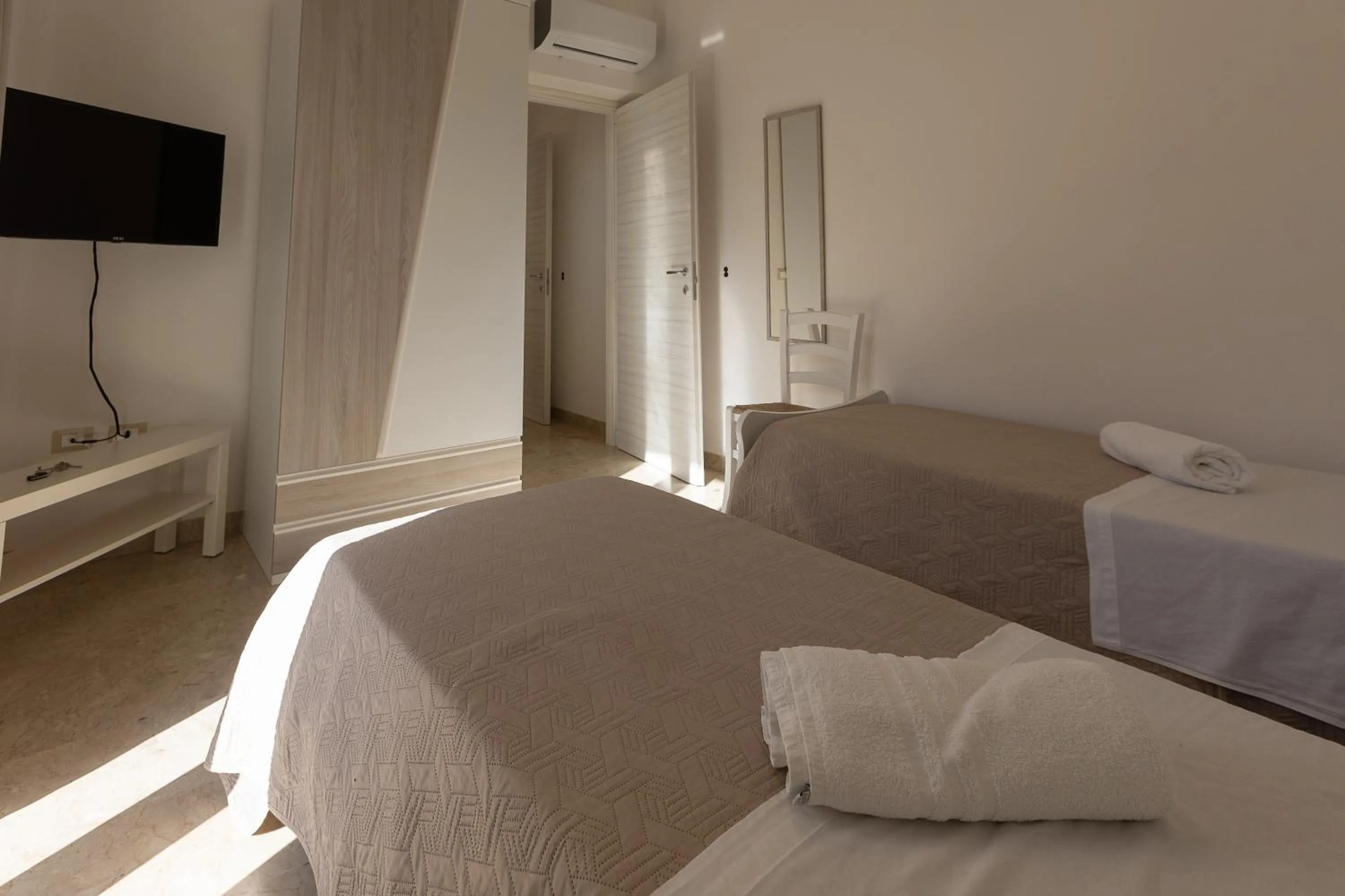 Bed in La Rosa Dei Venti - Free Parking, Air Conditioning and Wi-Fi