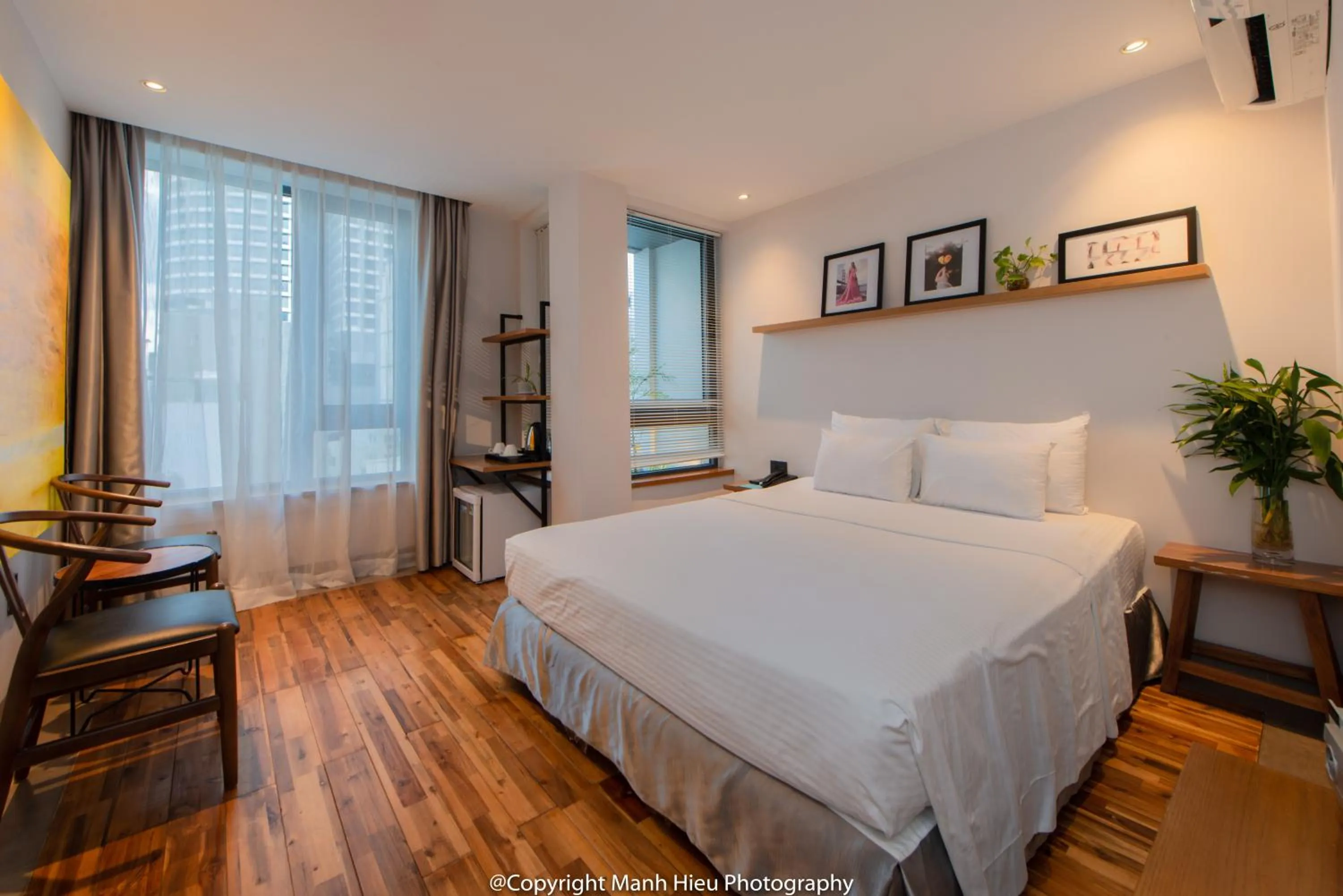 Bed in Mojzo Inn Boutique Hotel