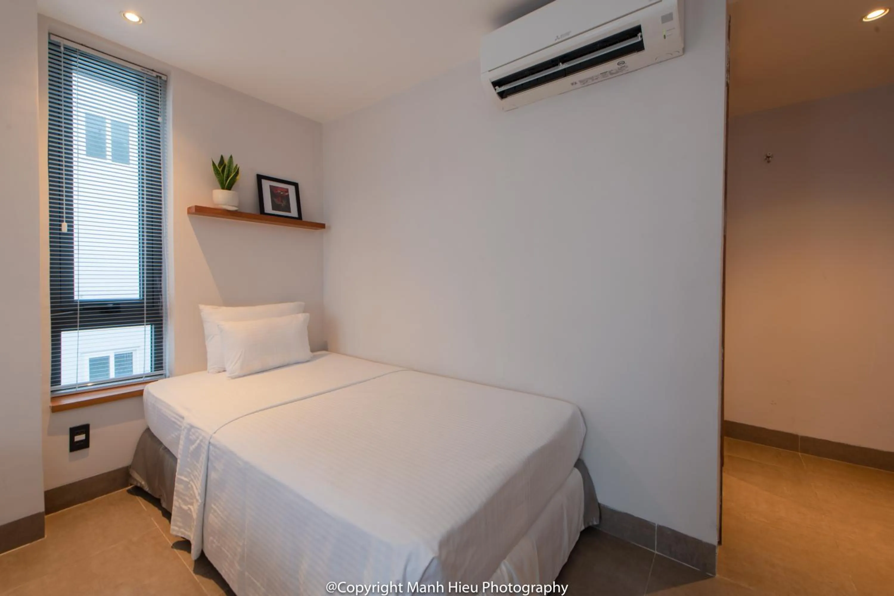 Bed in Mojzo Inn Boutique Hotel