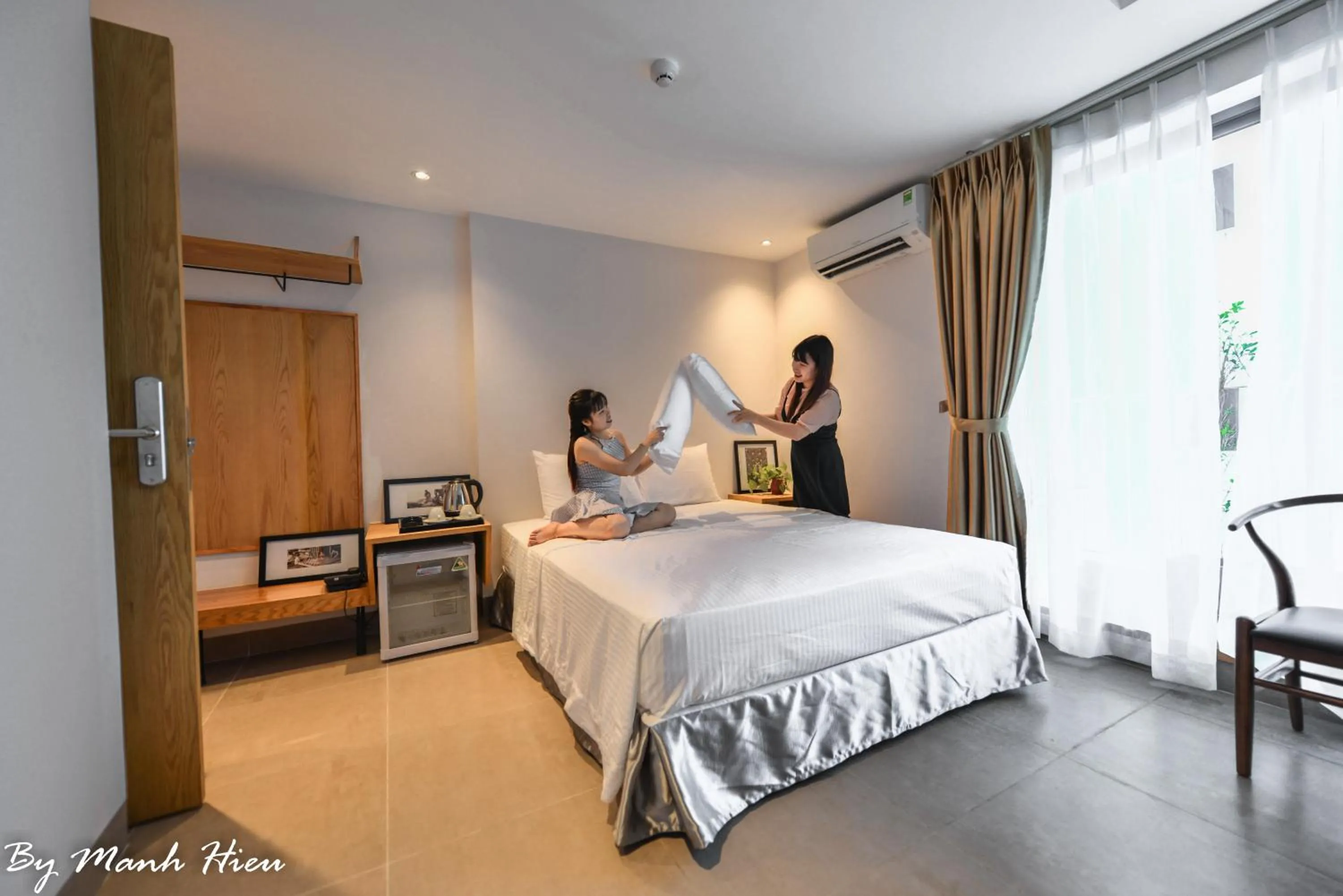 Bed in Mojzo Inn Boutique Hotel