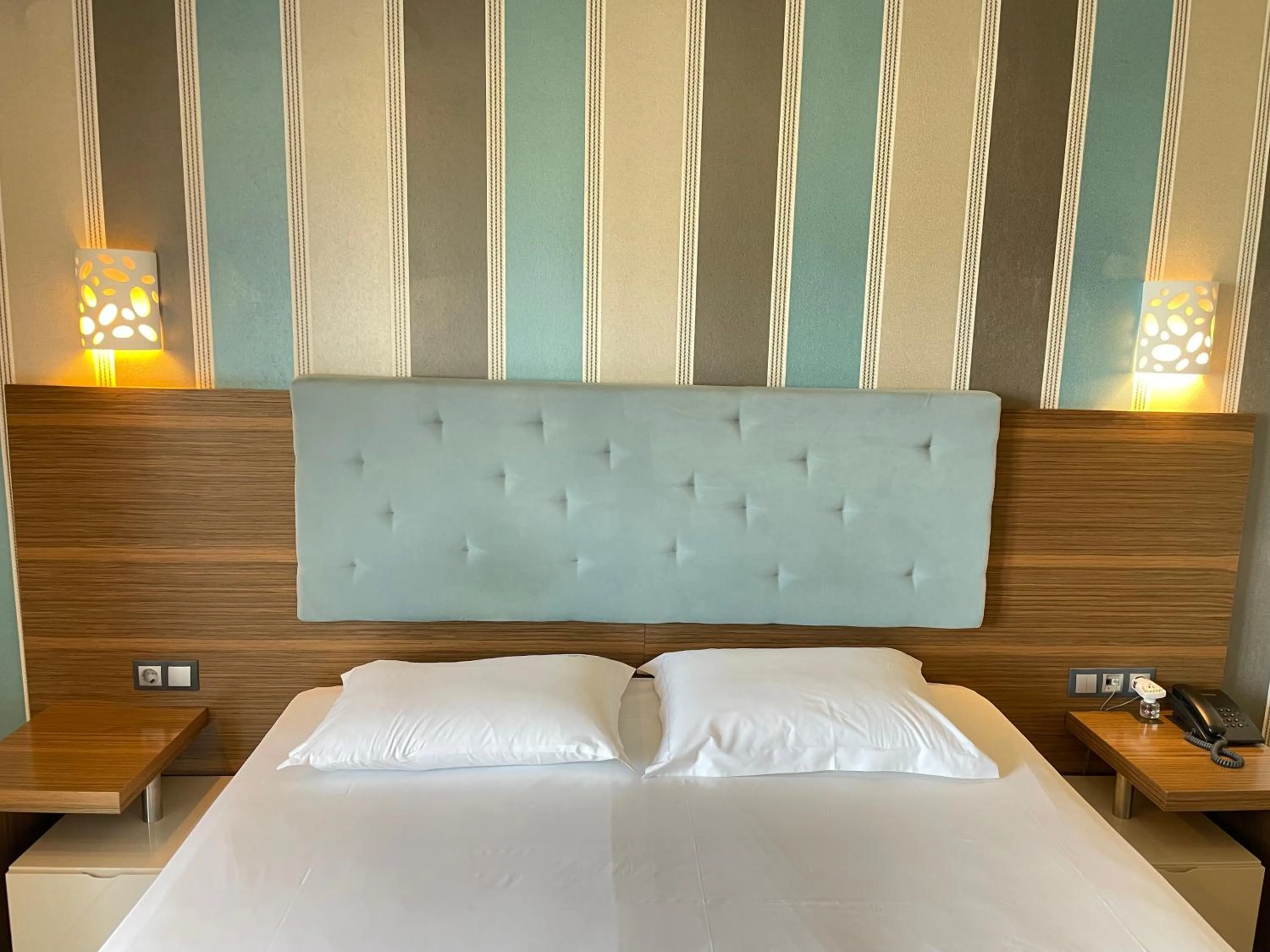 Bed in Porto Del Sol Hotel