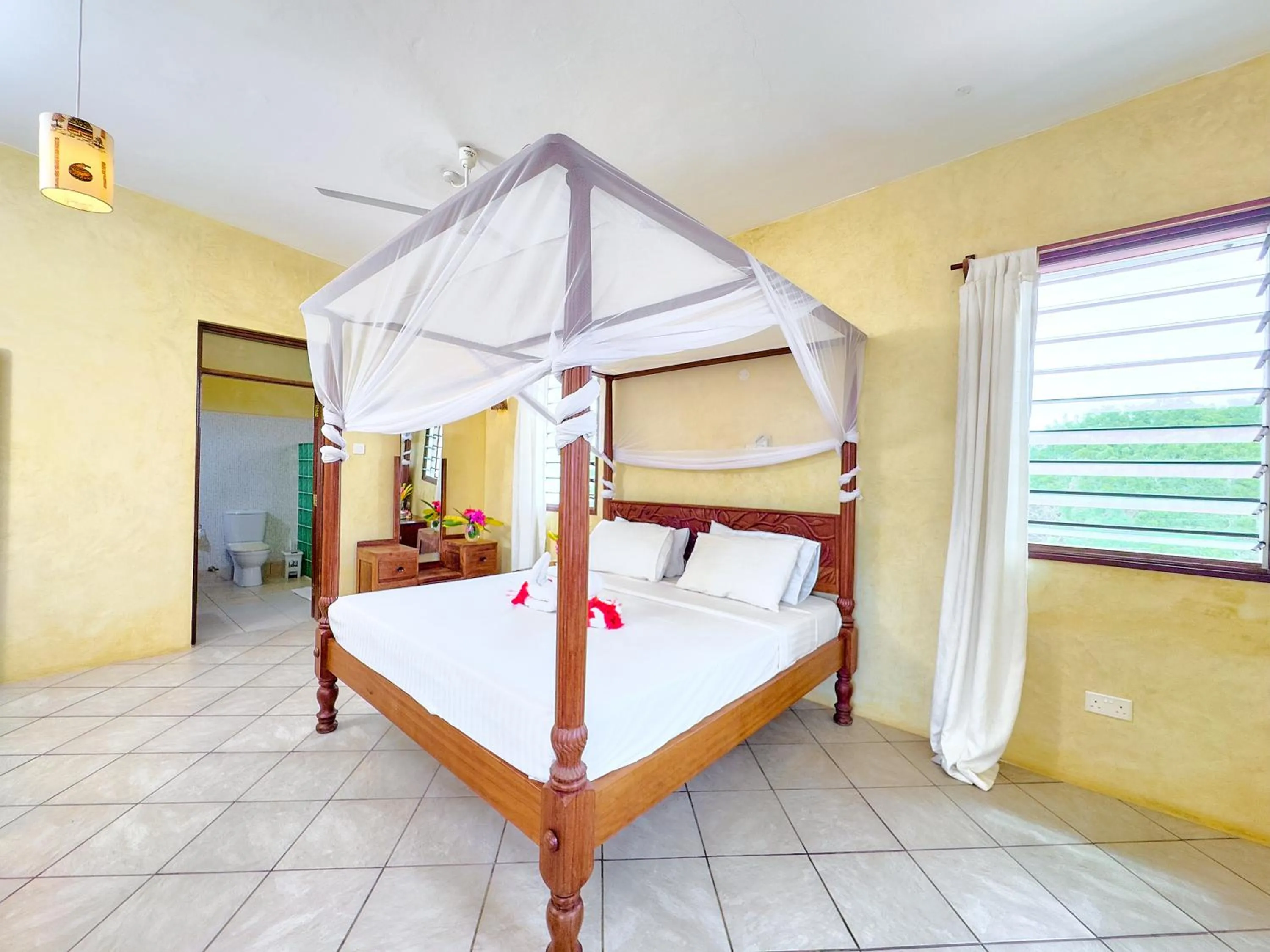 Bed in Flametree Beach Homes