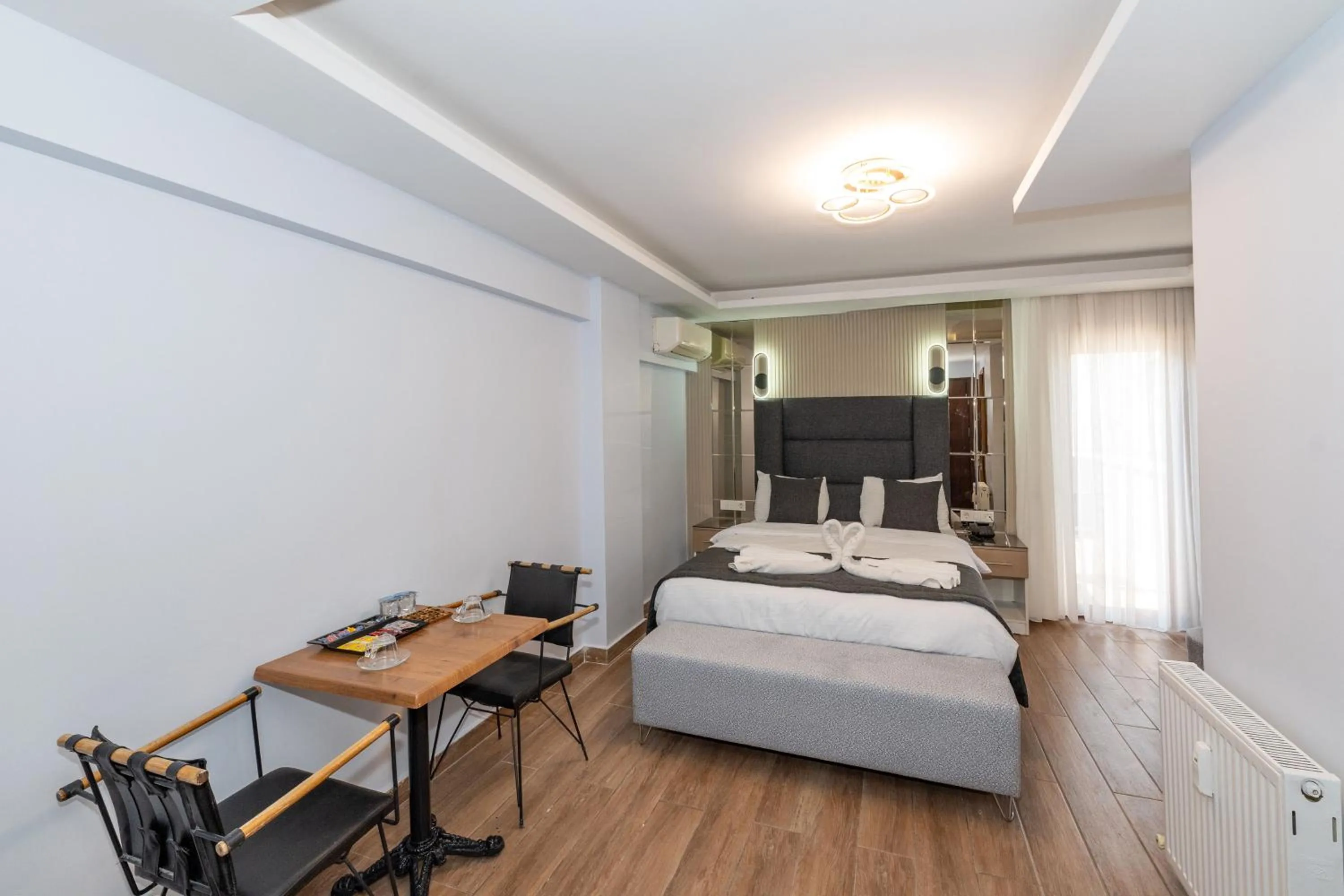 Seating area, Bed in T-Square Residence