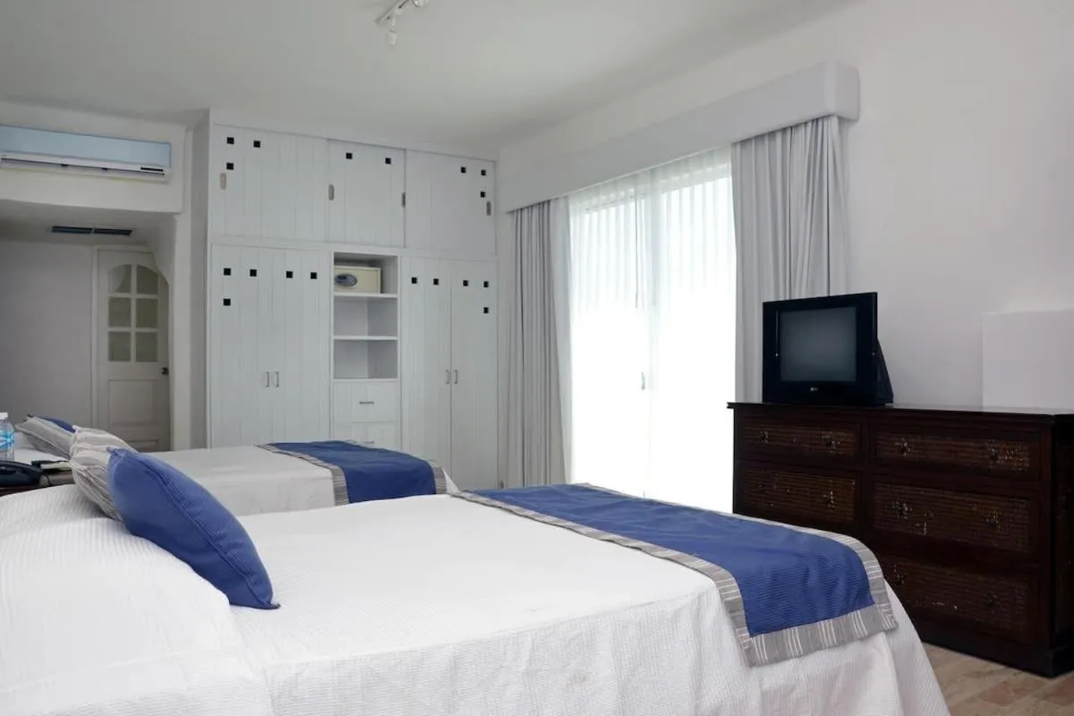 Bed in BSEA Cancun Plaza Hotel