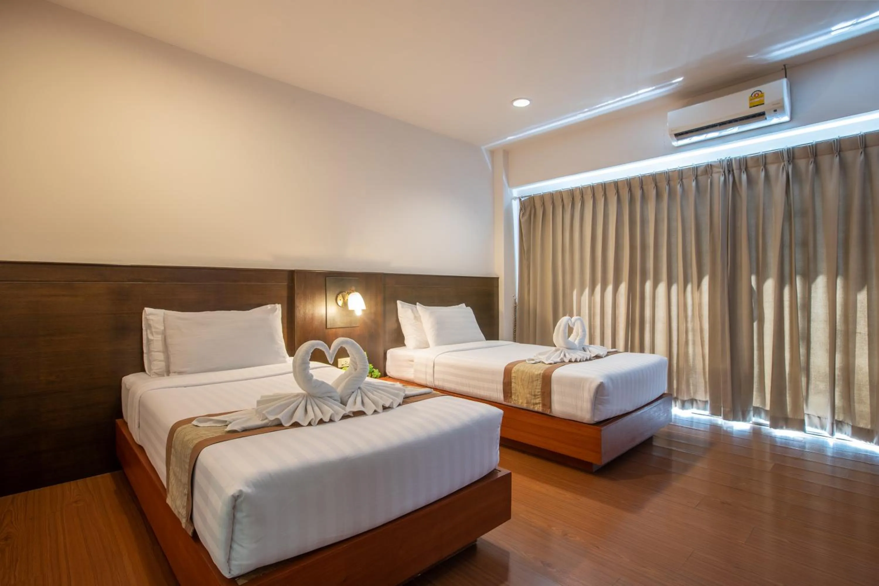 Bed in Pimann Inn Hotel