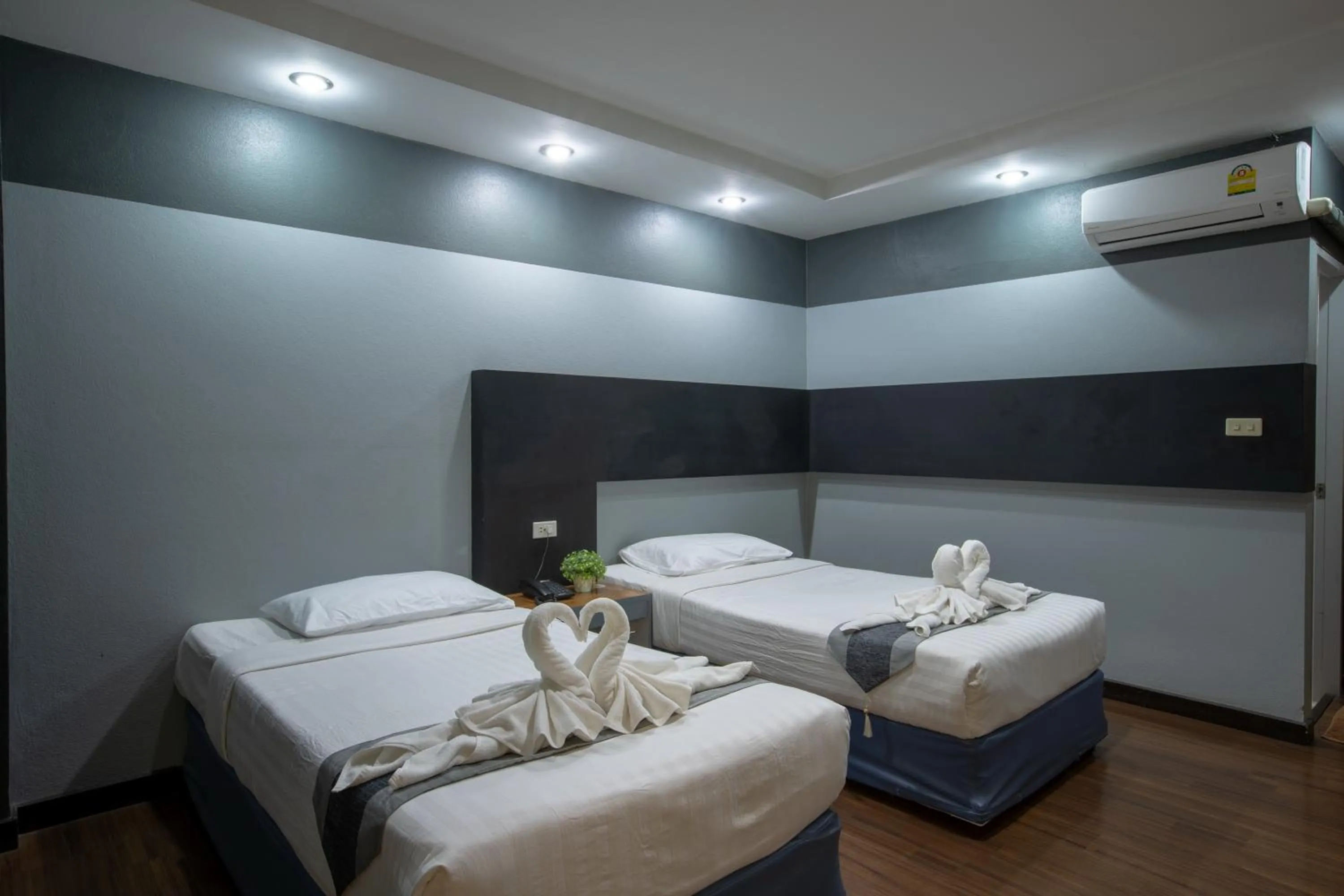 Bed in Pimann Inn Hotel