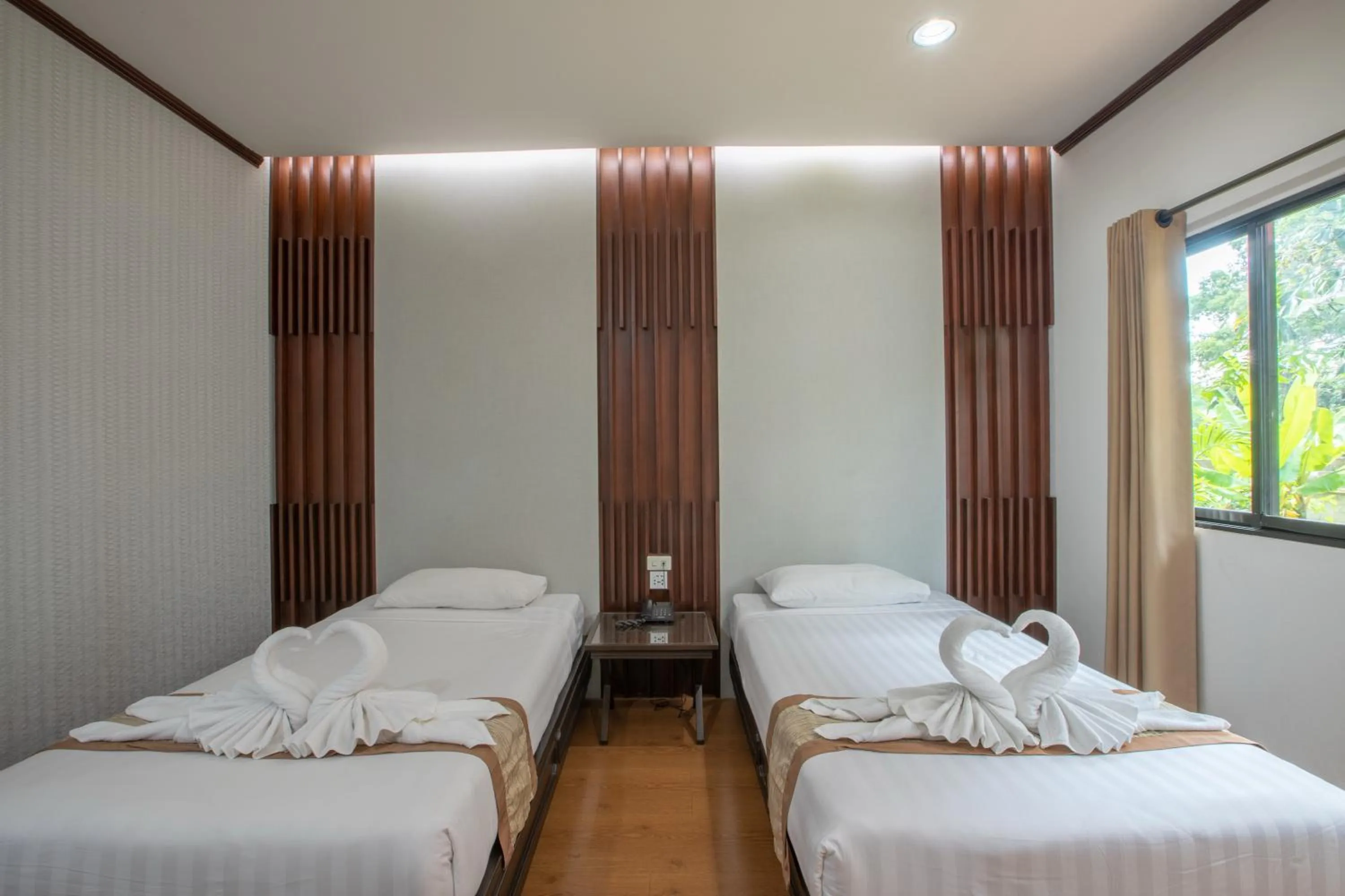 Bed in Pimann Inn Hotel