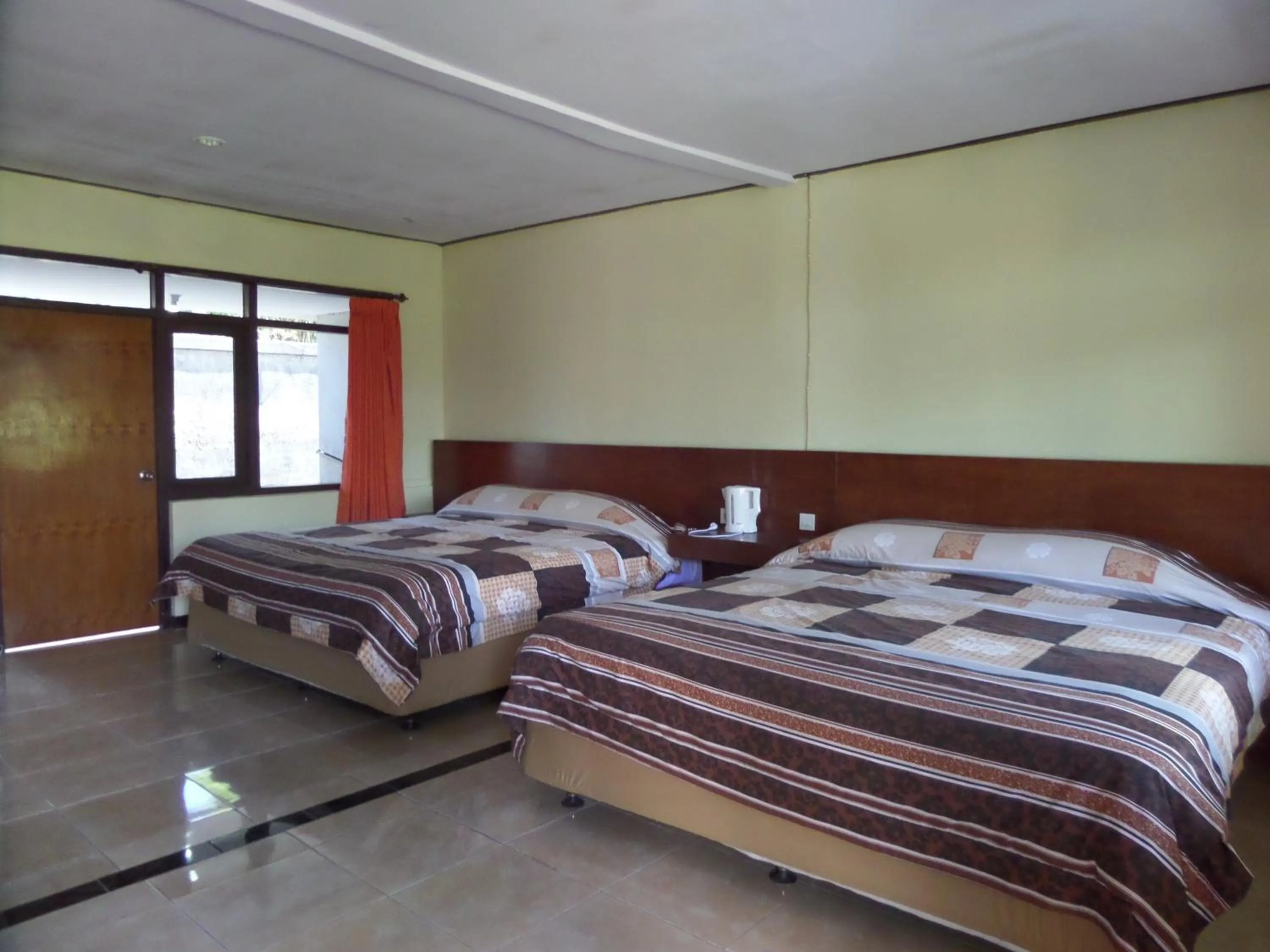 Photo of the whole room, Bed in Bromo Permai 1