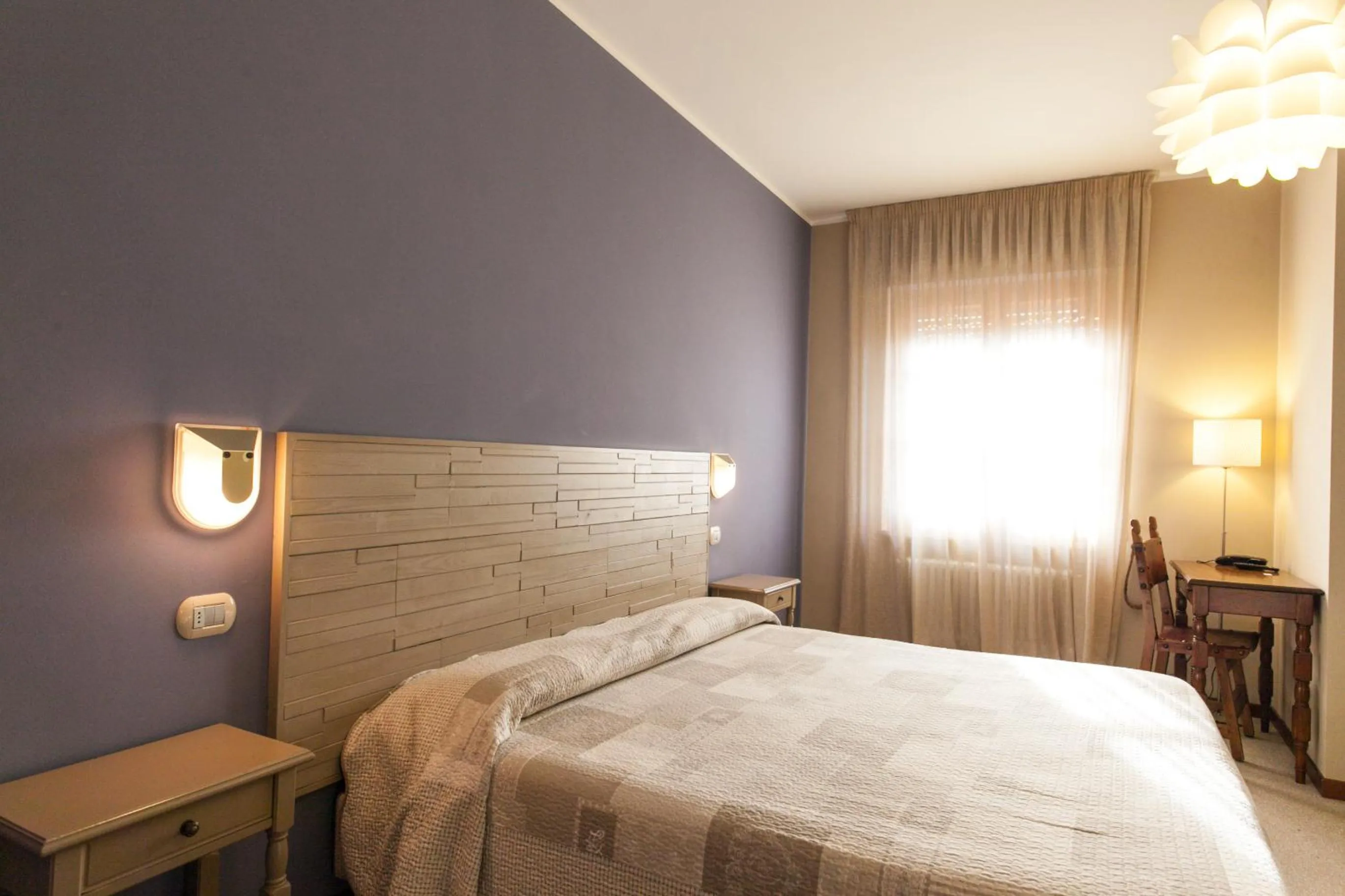 Bed in La Grotta Hotel