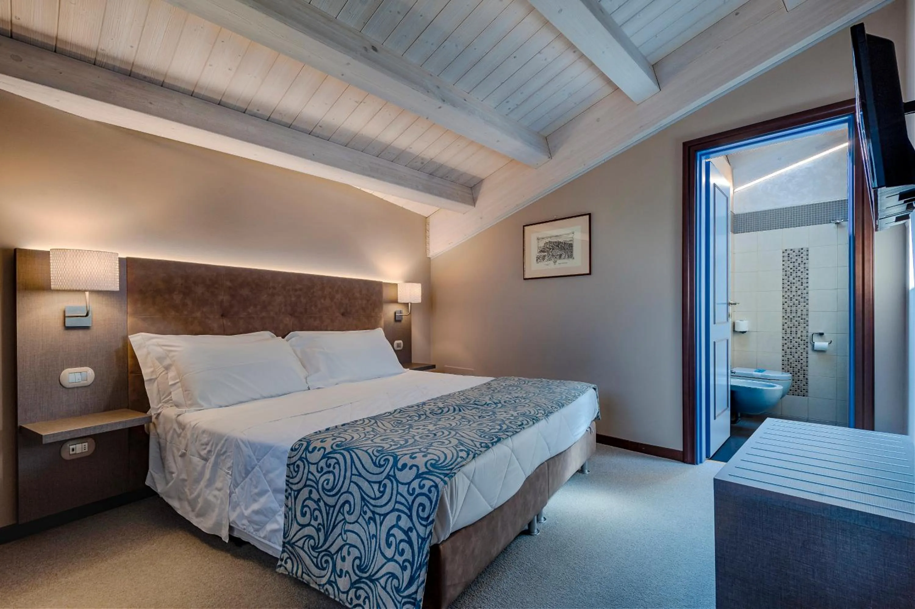 Bed in La Grotta Hotel