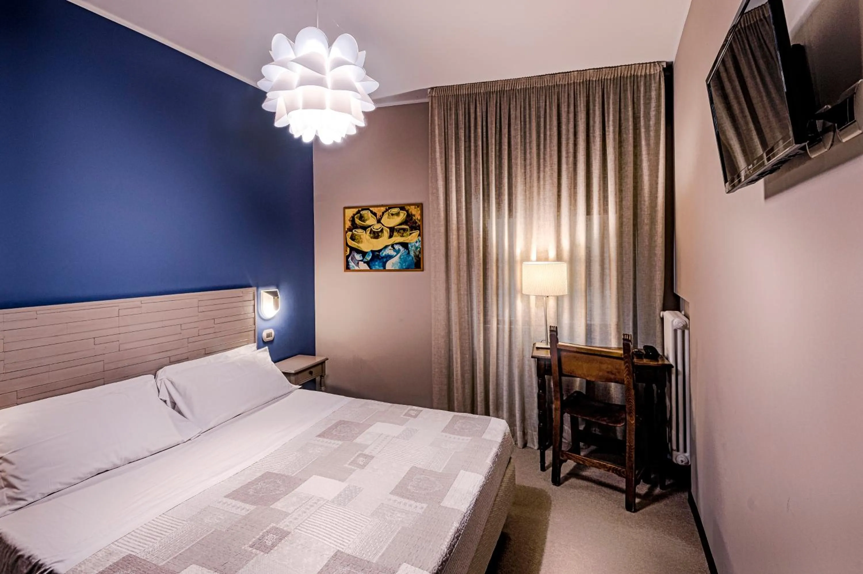 Bed in La Grotta Hotel