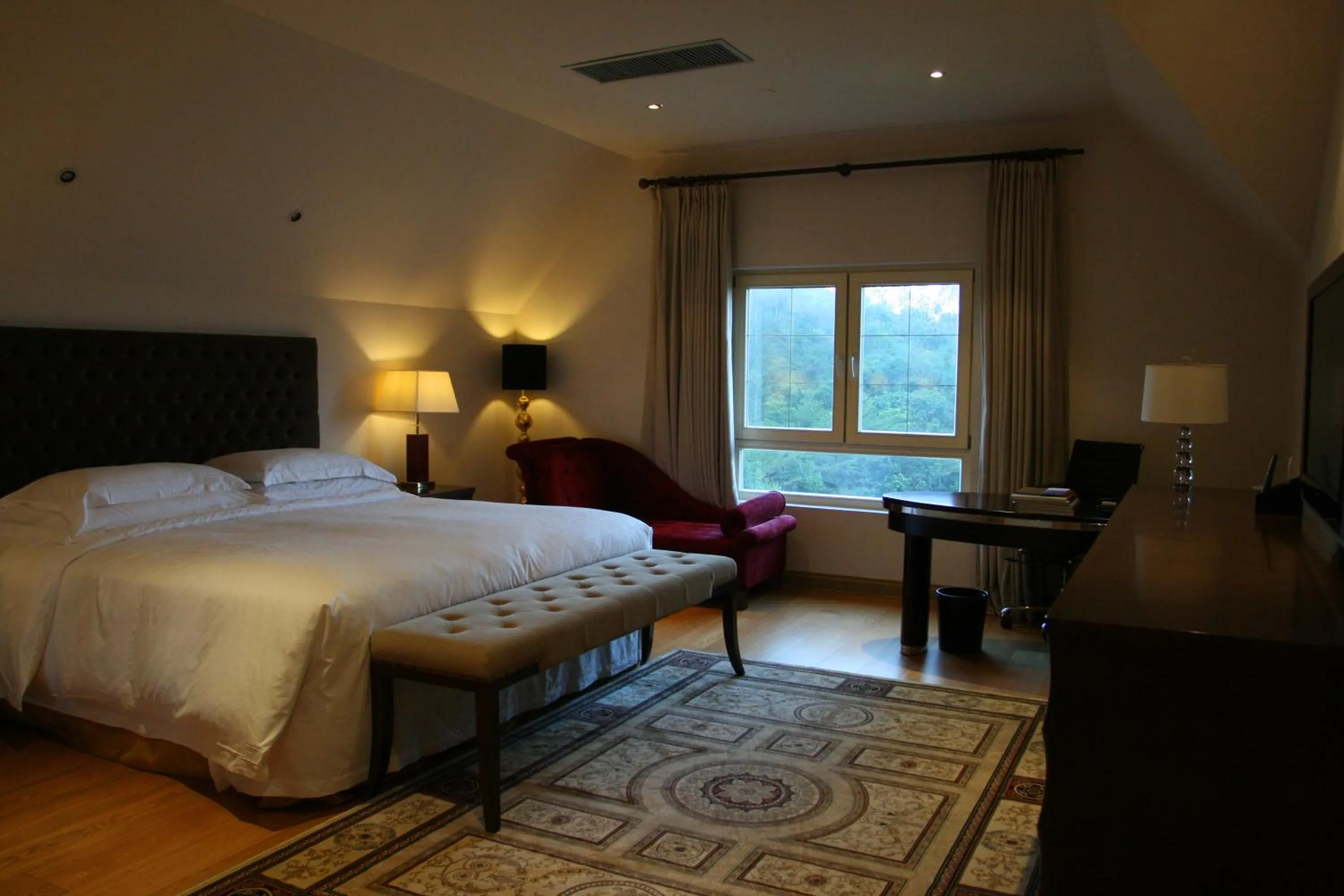 Bed in The Interlaken OCT Hotel