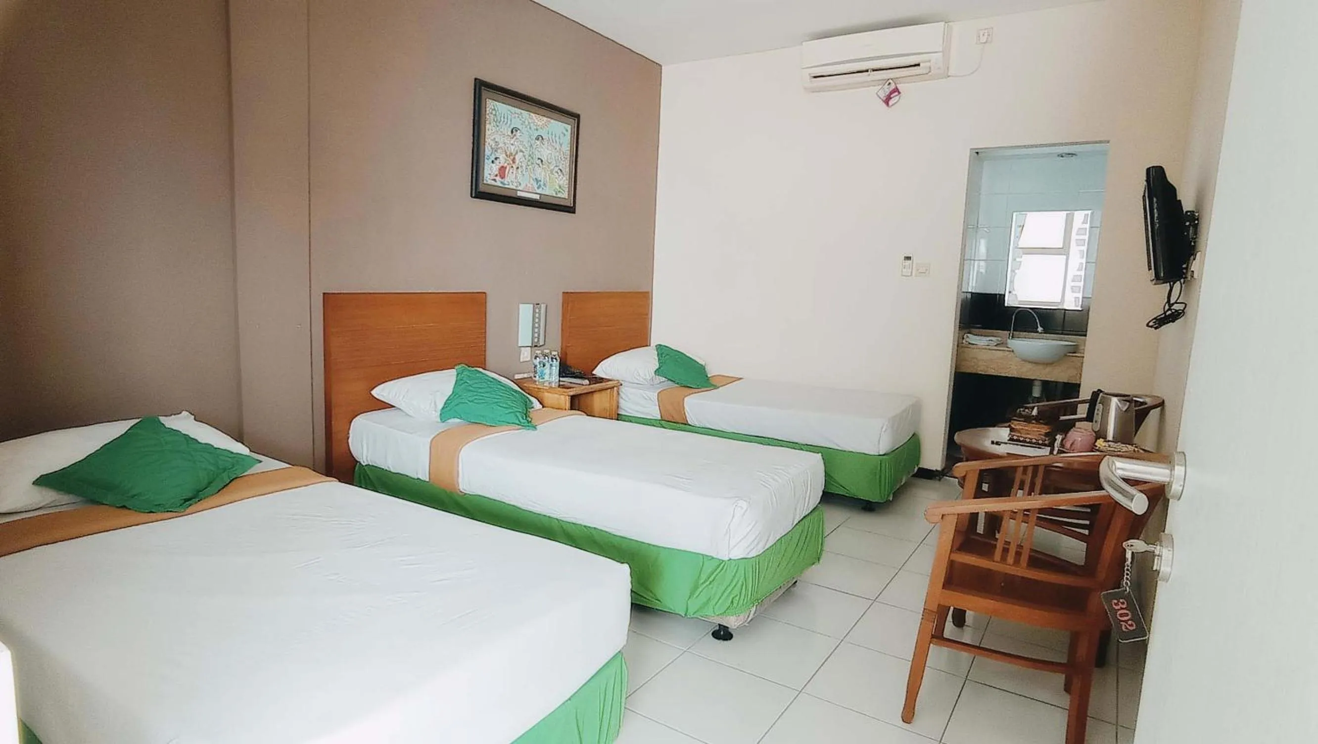 Bed in Helios Hotel Malang